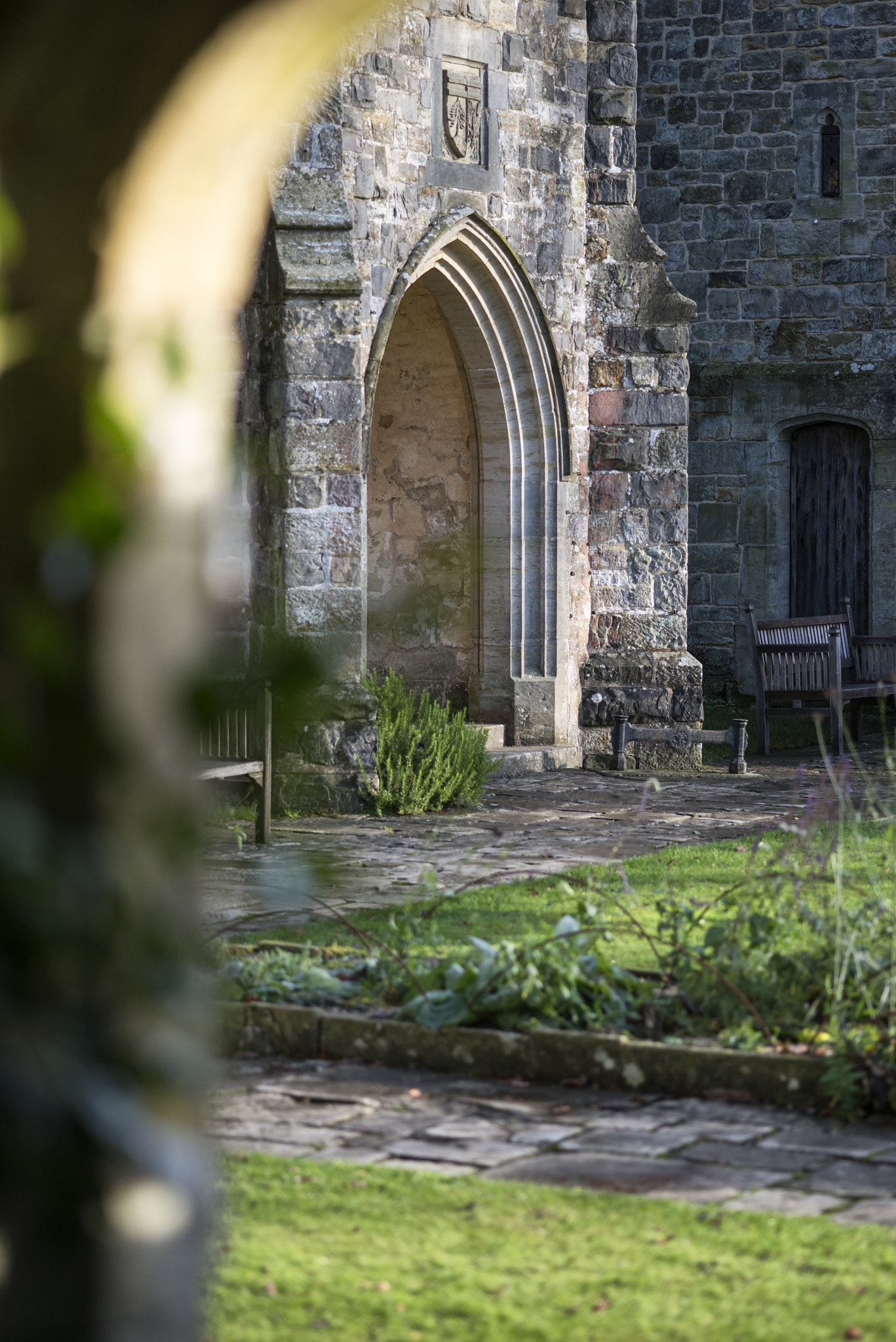 Nikon D800 + Sigma 105mm F2.8 EX DG Macro sample photo. View through stone archway into beautiful medieval landscape gar photography