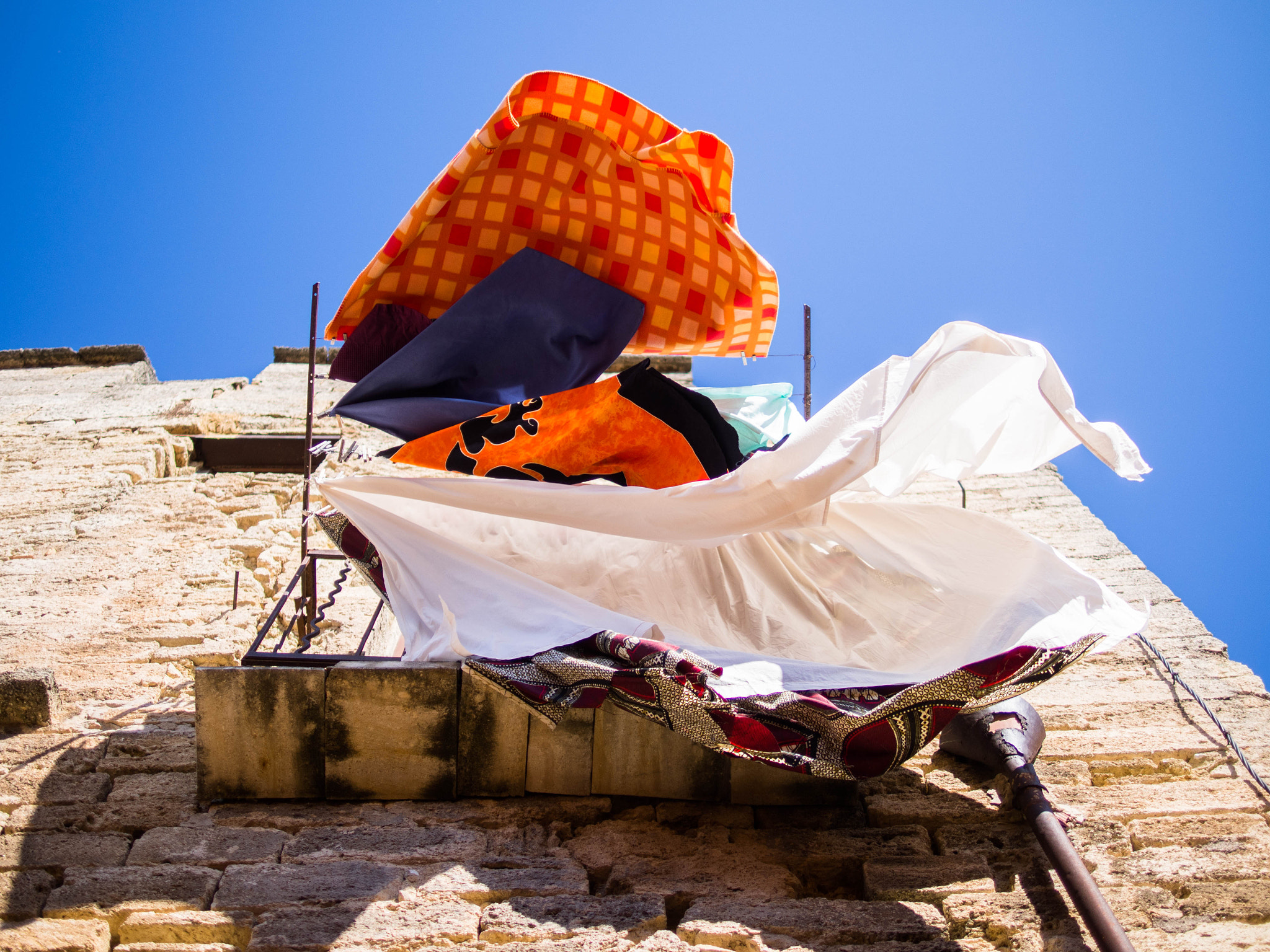 Panasonic Leica DG Summilux 25mm F1.4 II ASPH sample photo. Sheet drying in the sky photography