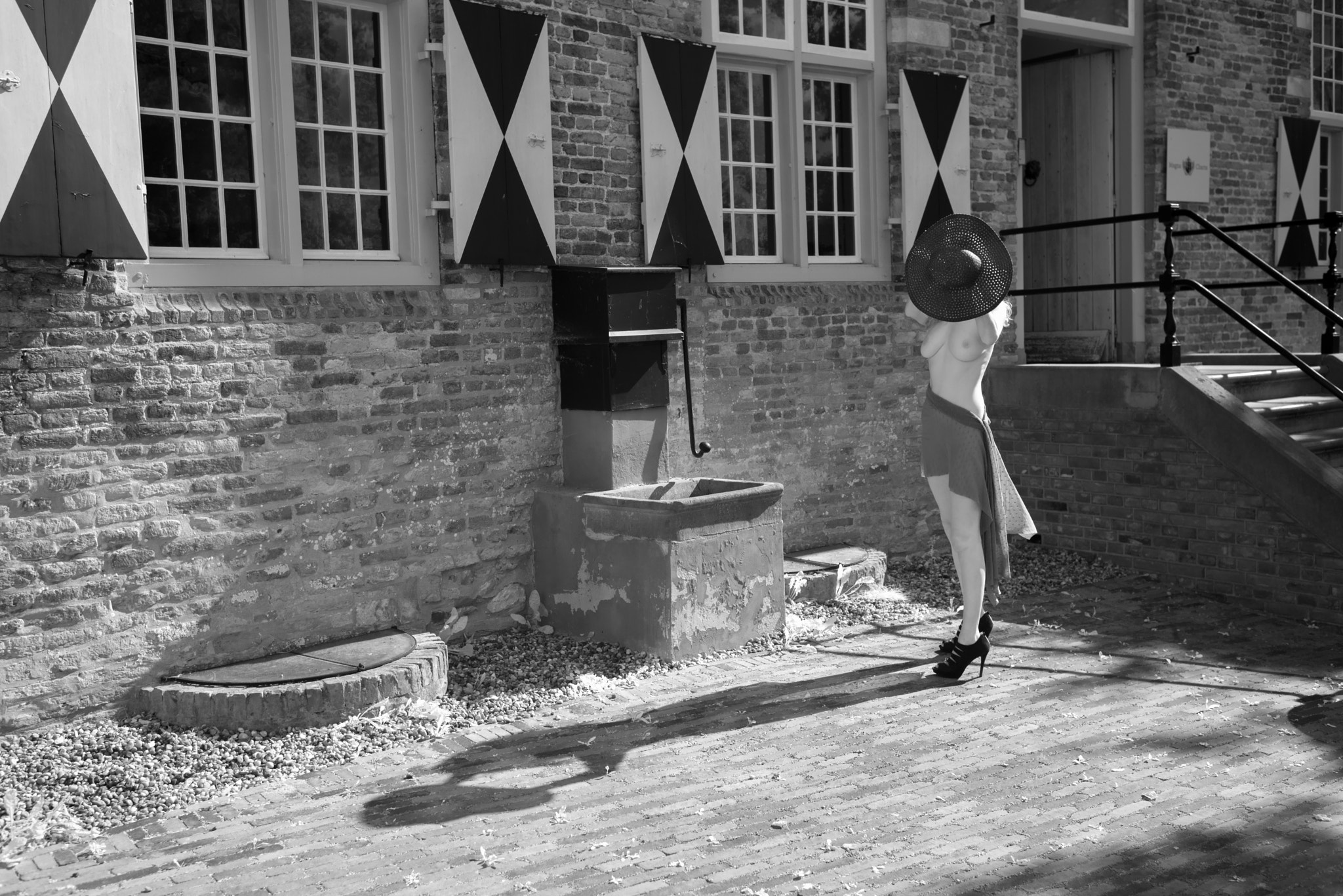 Nikon D800 + Nikon AF-S Nikkor 35mm F1.4G sample photo. Model with hat on castle square photography