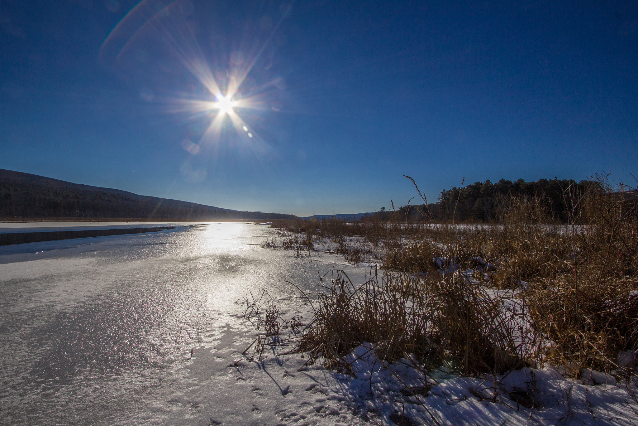 Canon EF-S 10-22mm F3.5-4.5 USM sample photo. Flaring sun over the basha kill photography