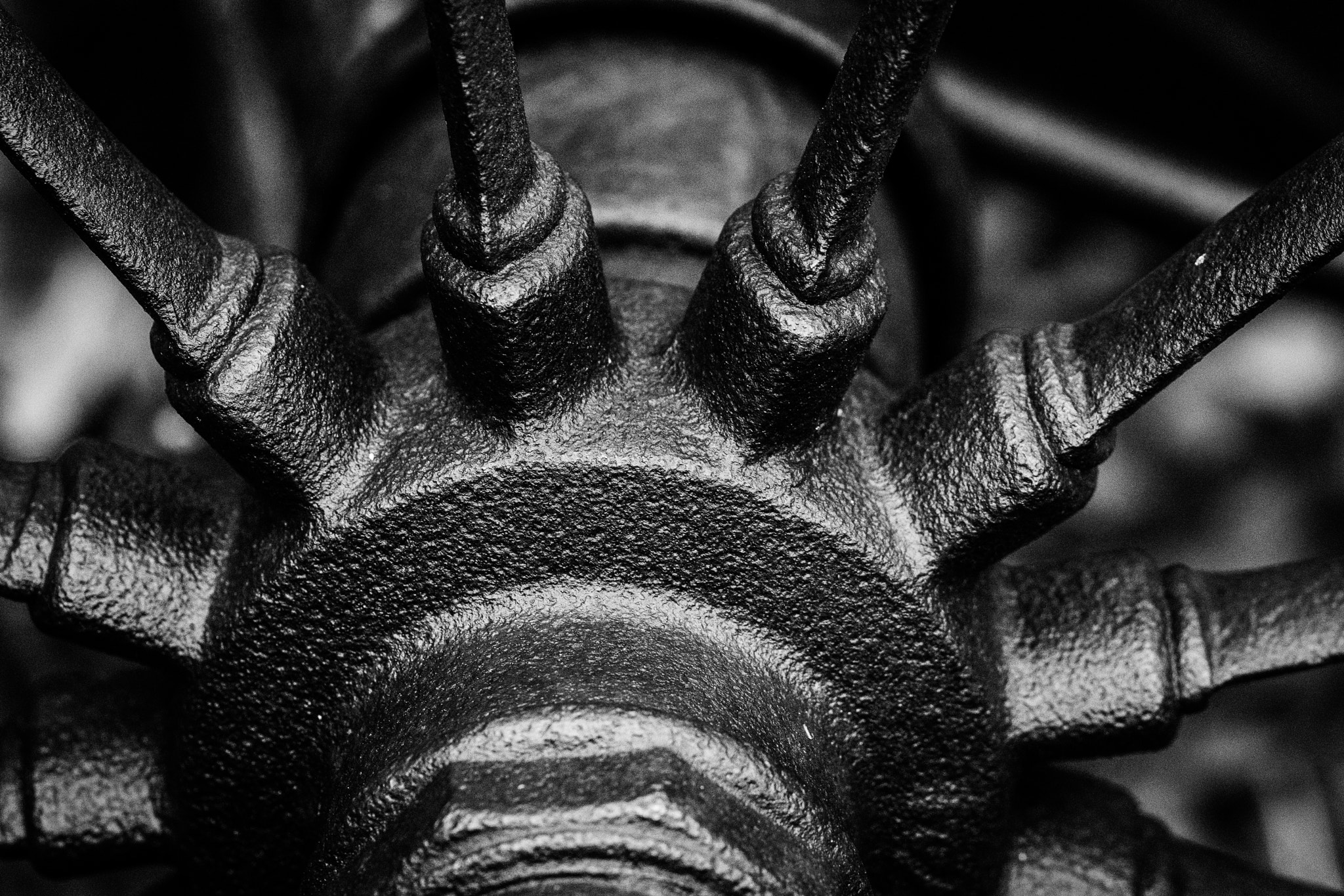 Sony a6000 + Sony FE 90mm F2.8 Macro G OSS sample photo. Old cultivator wheel in b&w photography