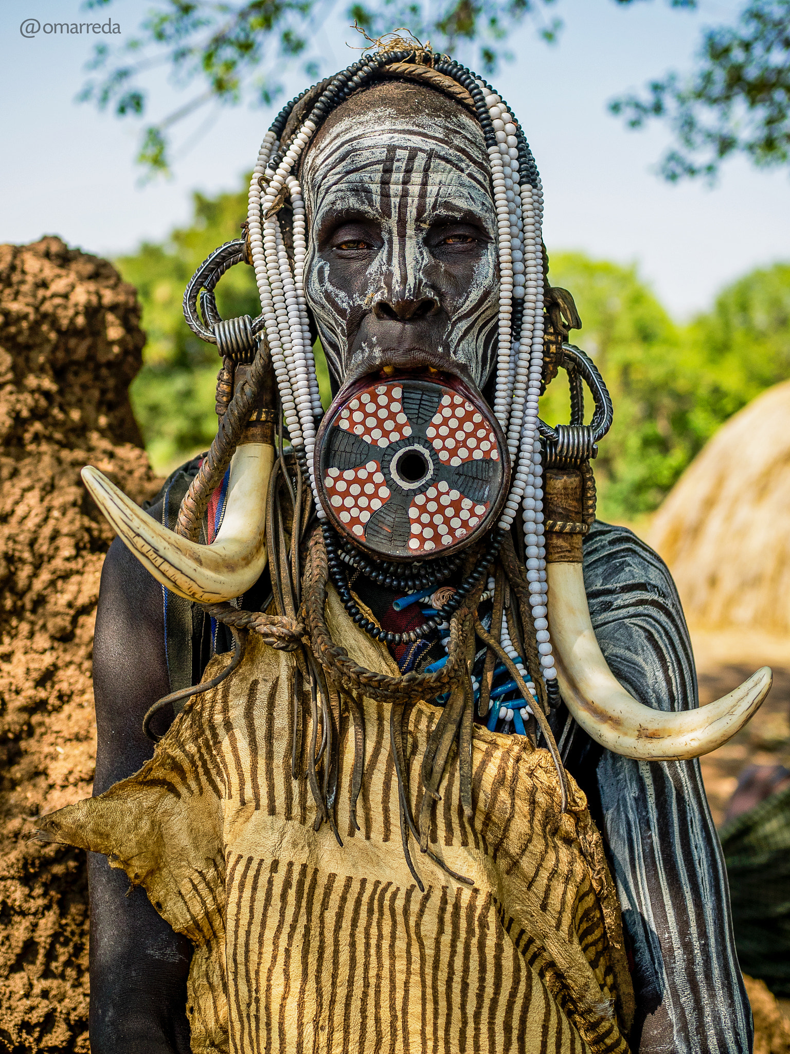 Olympus OM-D E-M1 + Olympus M.Zuiko Digital 25mm F1.8 sample photo. Woman from the mursi tribe photography
