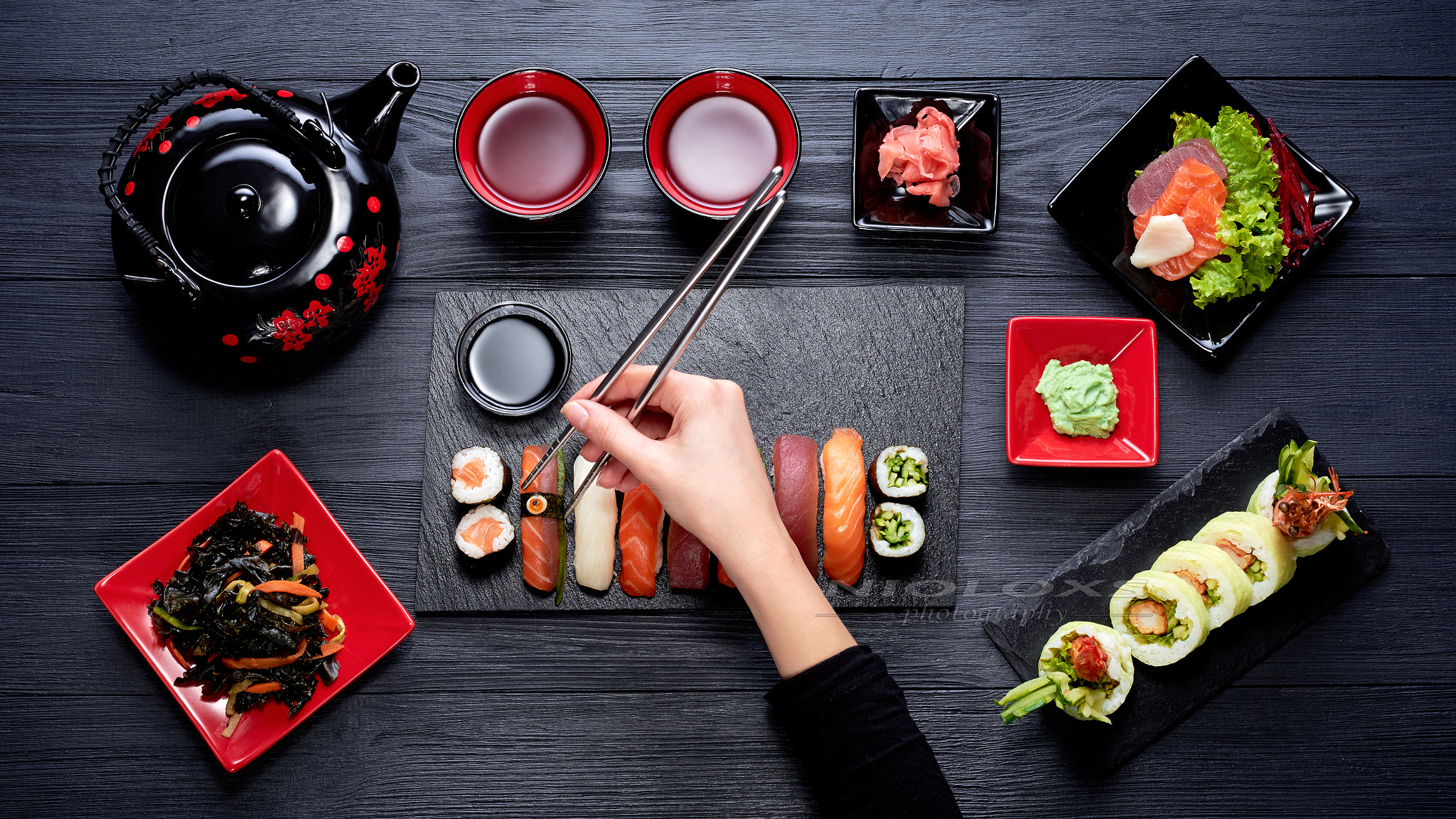 Nikon AF Nikkor 50mm F1.8D sample photo. Woman eating sushi with chopsticks top view photography