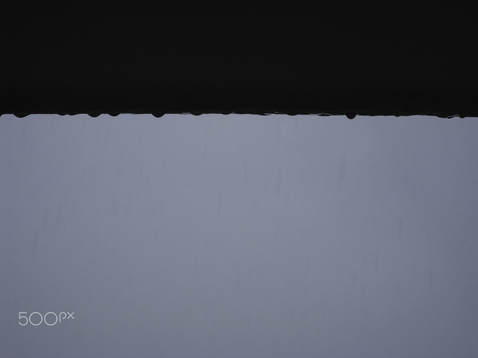 Canon POWERSHOT SD850 IS sample photo. Water droplets clinging and dropping from a ledge after rain photography