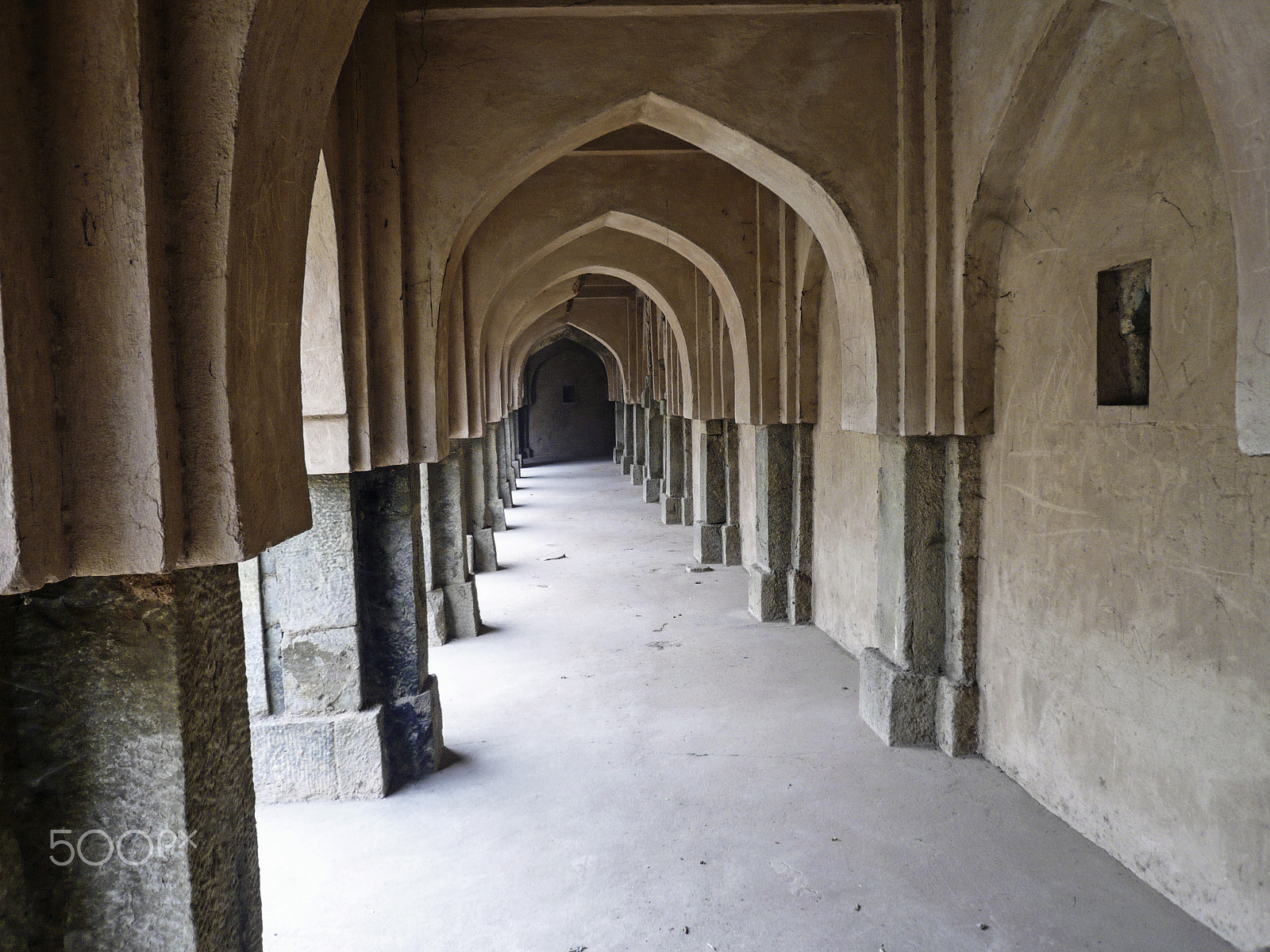 Panasonic DMC-FX100 sample photo. Archways, pillars and the long corridor of an old baoli in mehra photography