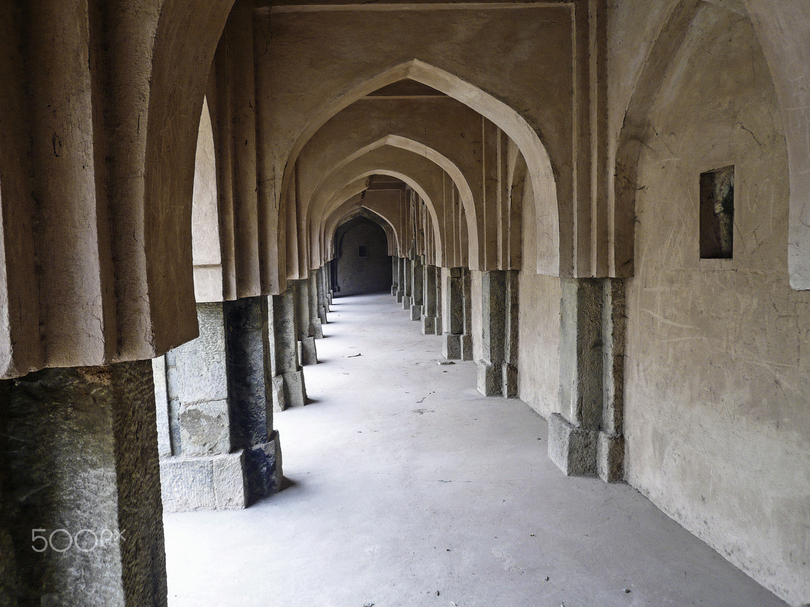 Panasonic DMC-FX100 sample photo. Archways, pillars and the long corridor of an old baoli in mehra photography