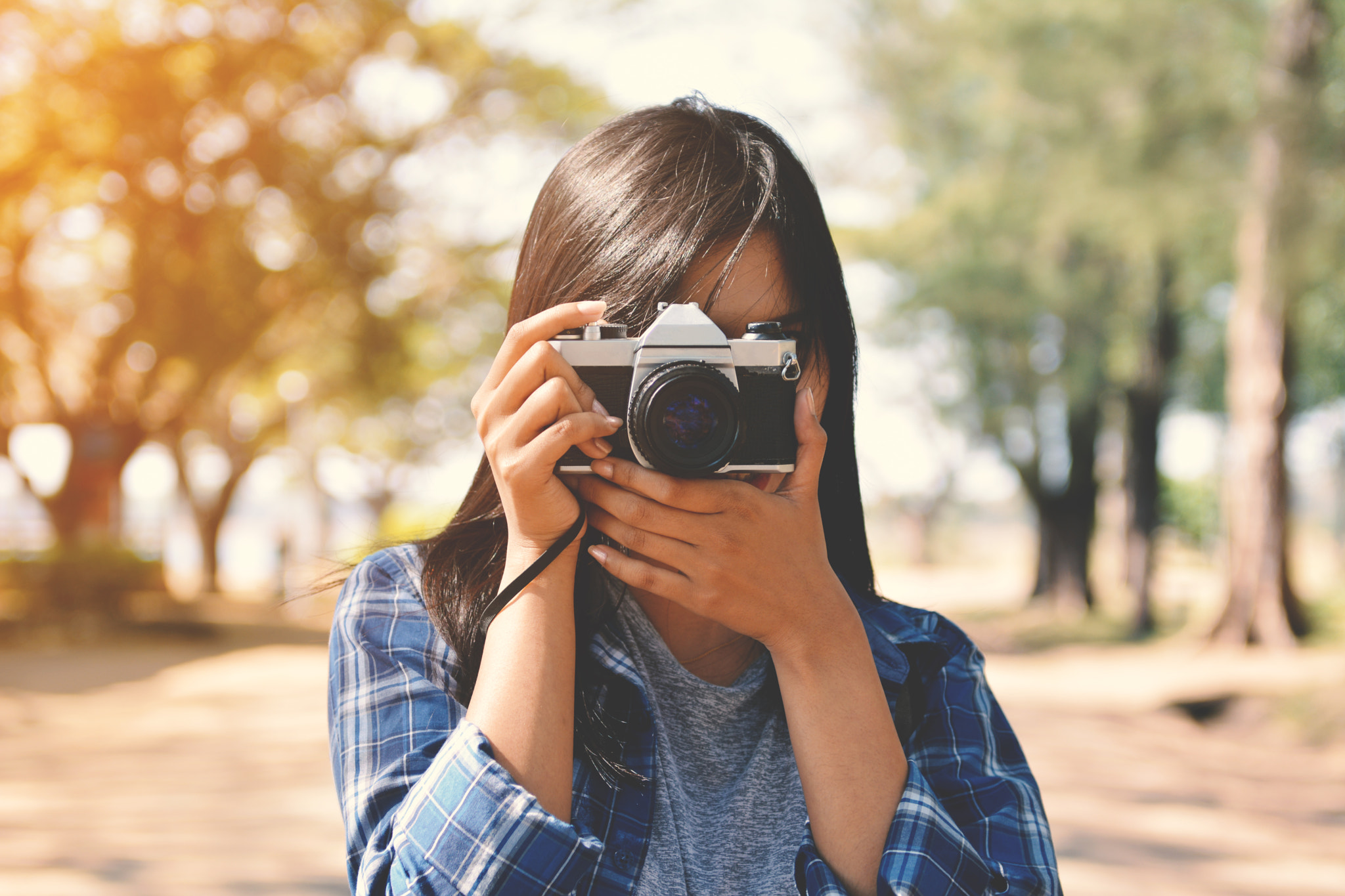 Nikon AF-S Nikkor 24-70mm F2.8G ED sample photo. Asian women holding a camera shooting in nature and relax time on holiday.concept travel color of... photography