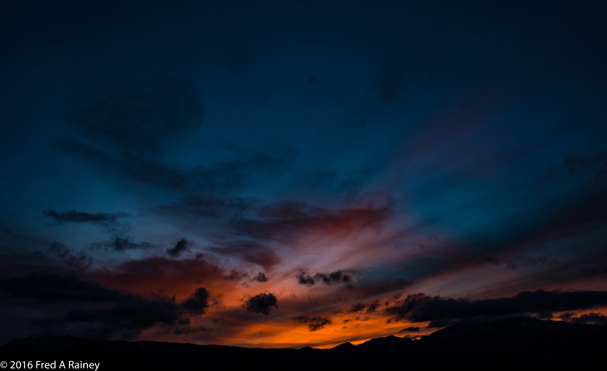 Nikon D810 + AF Zoom-Nikkor 35-70mm f/2.8D sample photo. Cloud painted sunset photography