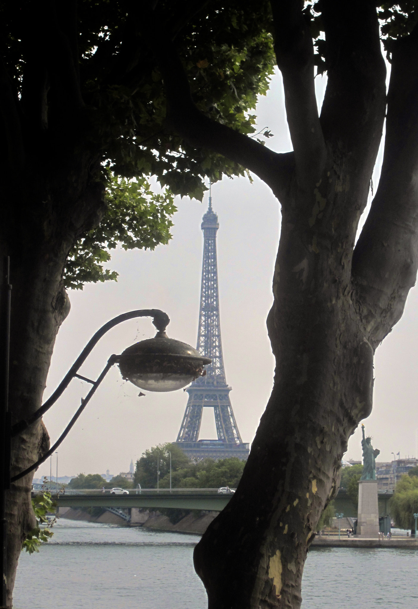 Canon PowerShot SD1300 IS (IXUS 105 / IXY 200F) sample photo. Eiffel tower peekaboo in paris, france photography