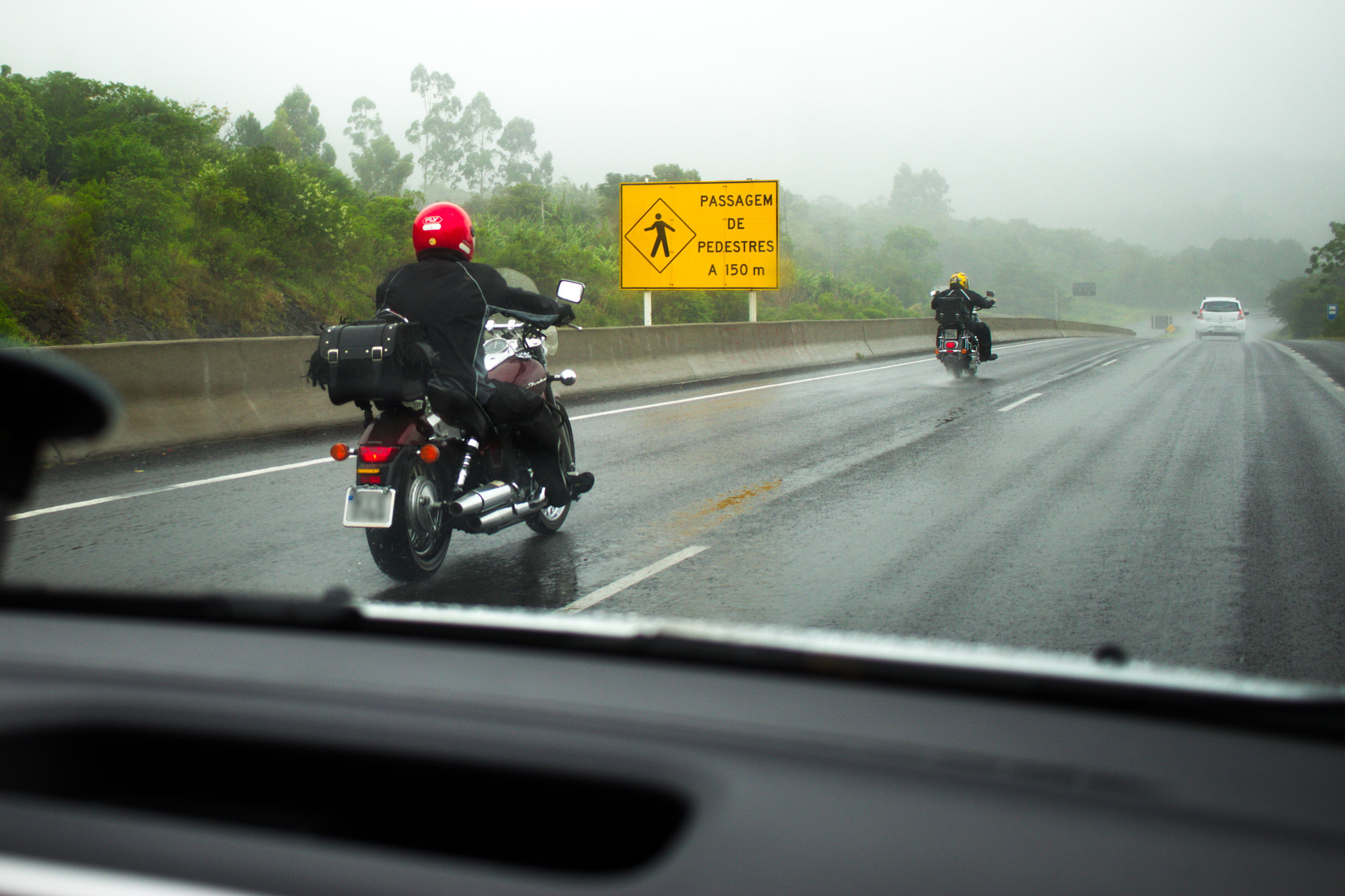 Canon EF-S 24mm F2.8 STM sample photo. Riding in the rain photography
