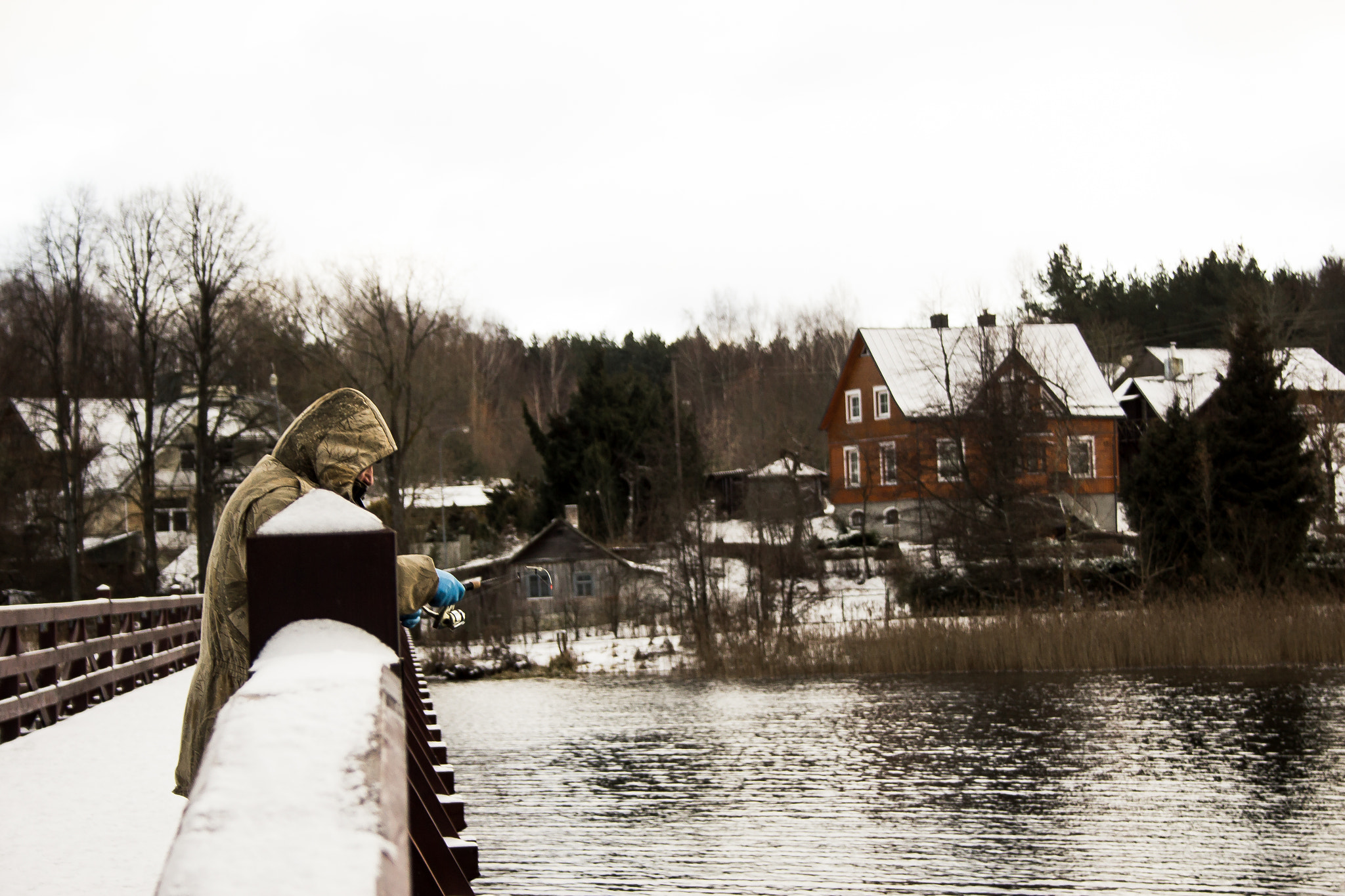 Canon EF-S 18-55mm F3.5-5.6 II sample photo. Man fishing in winter photography