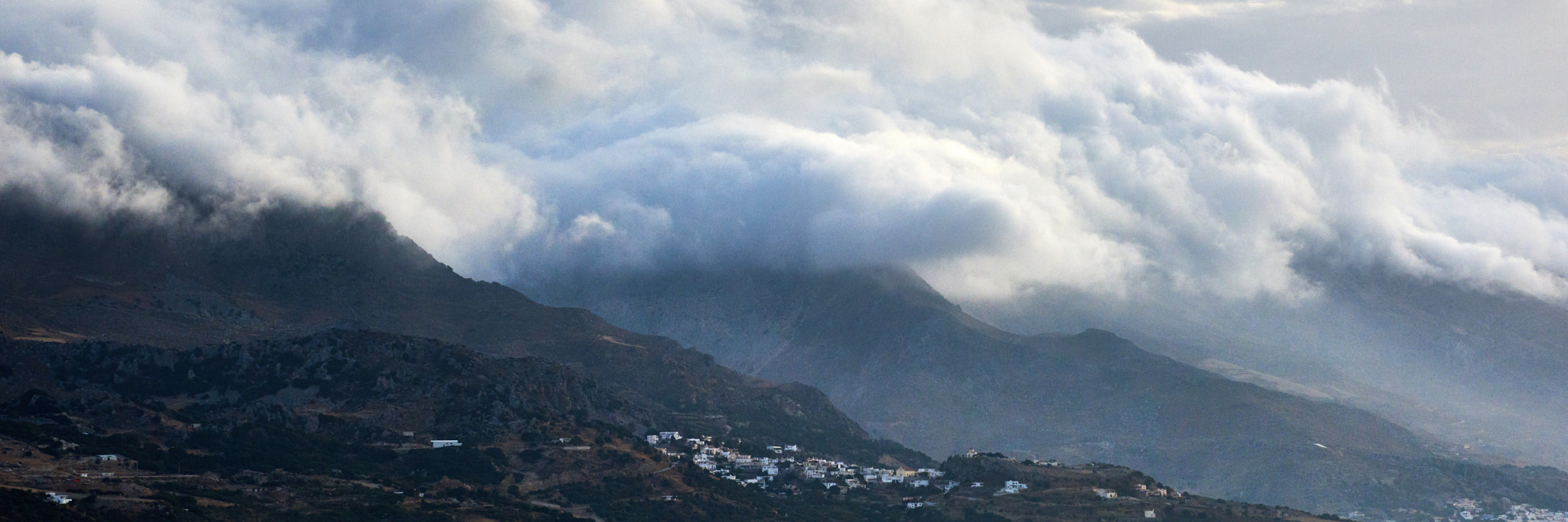 Nikon AF-S Nikkor 28-300mm F3.5-5.6G ED VR sample photo. Heavy clouds roll in over the mountains photography