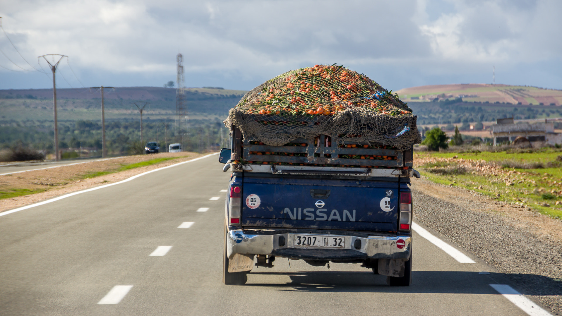 Sigma 18-250mm F3.5-6.3 DC OS HSM sample photo. Oranges on the road photography