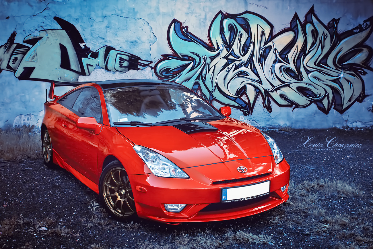 Canon EF 28mm F1.8 USM sample photo. Red celica with graffiti photography