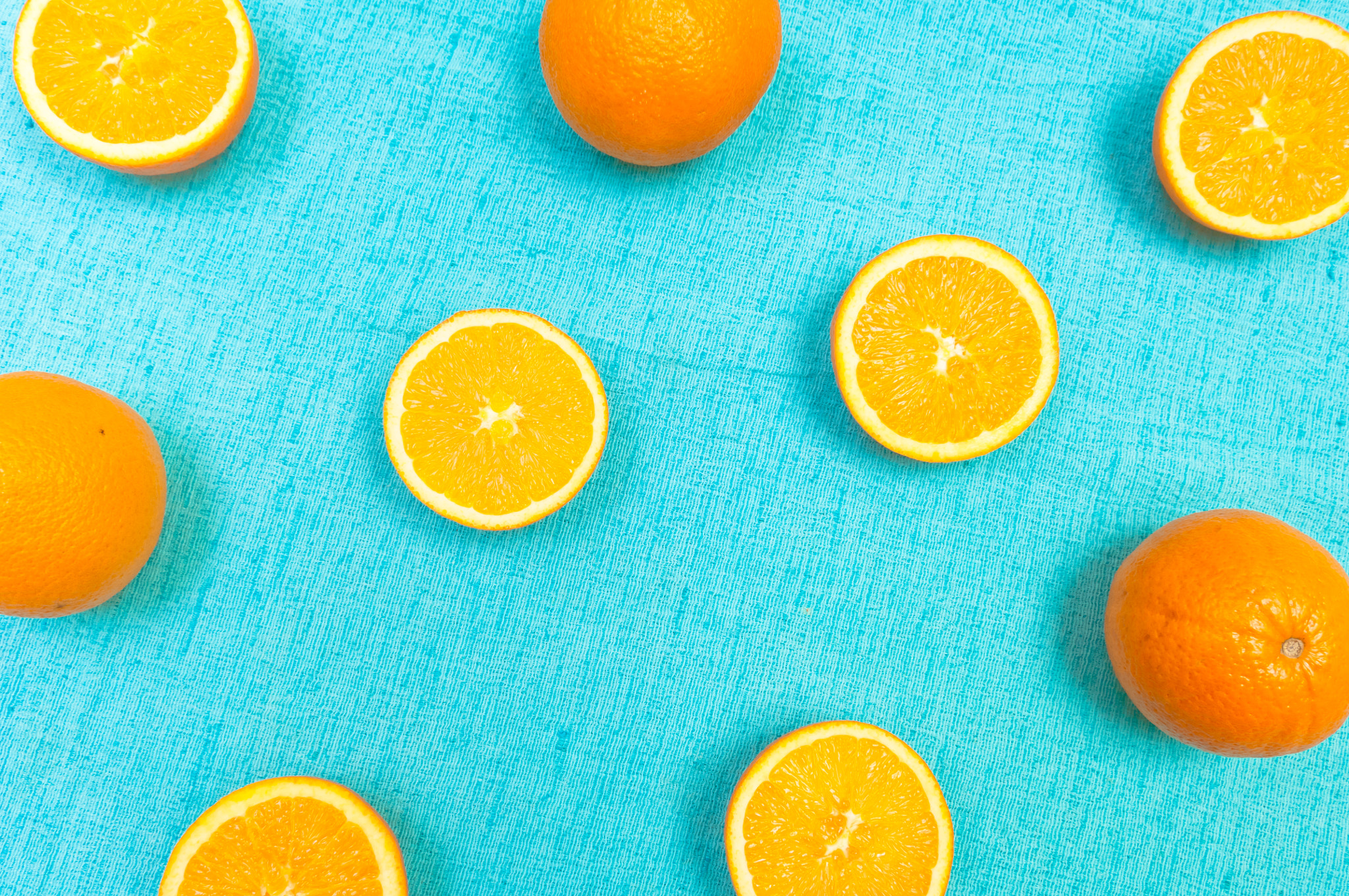 Nikon D2X sample photo. Orange and lemon citrus fruit pattern on light blue background photography