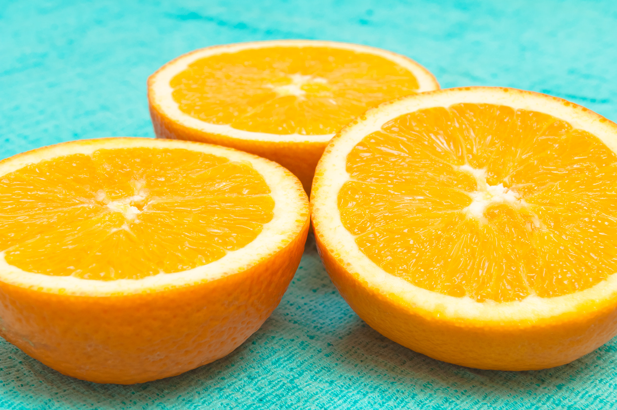 Nikon D2X sample photo. Orange and lemon citrus fruit pattern on light blue background photography