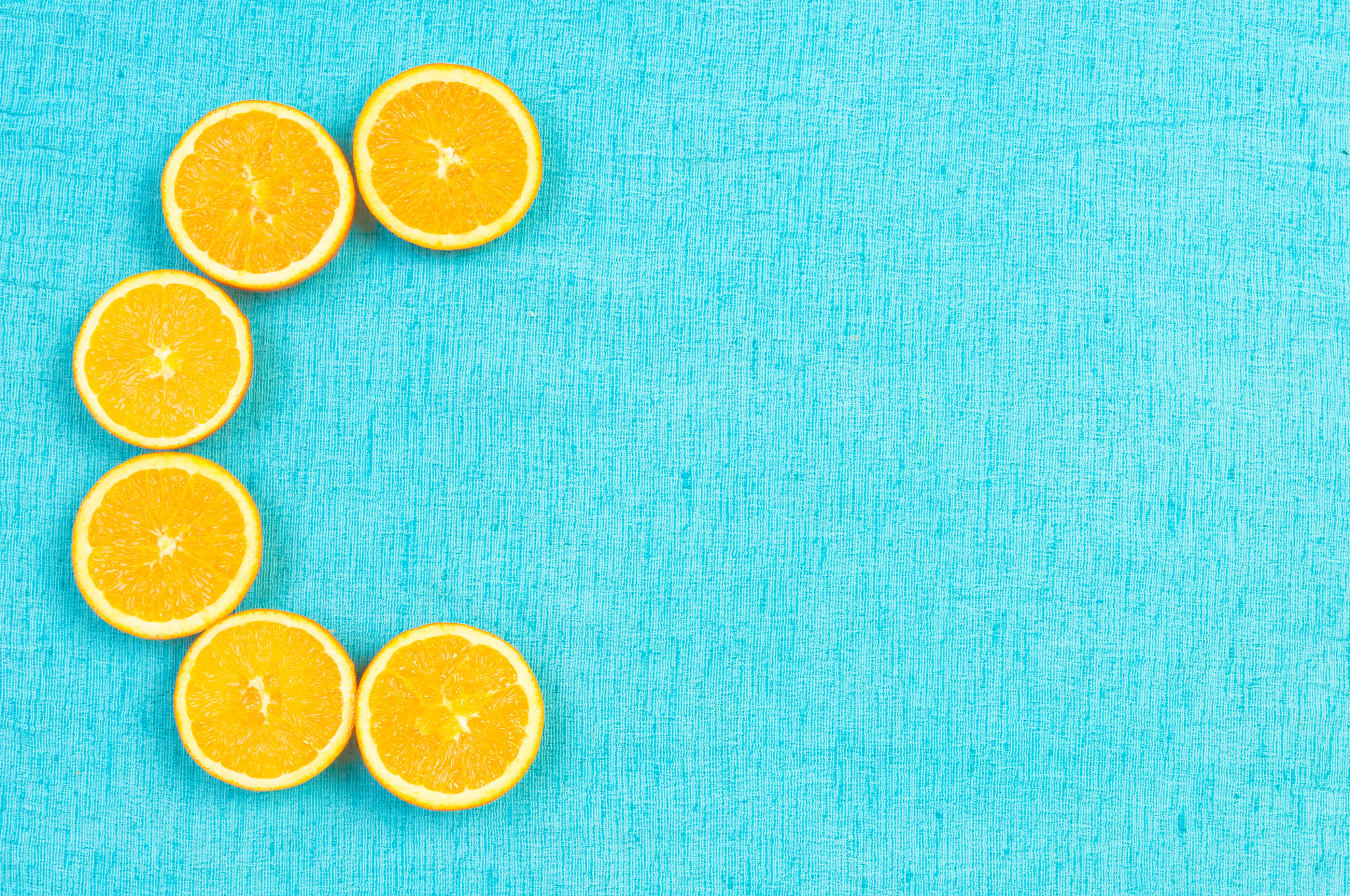 Nikon D2X sample photo. Orange and lemon citrus fruit pattern on light blue background photography