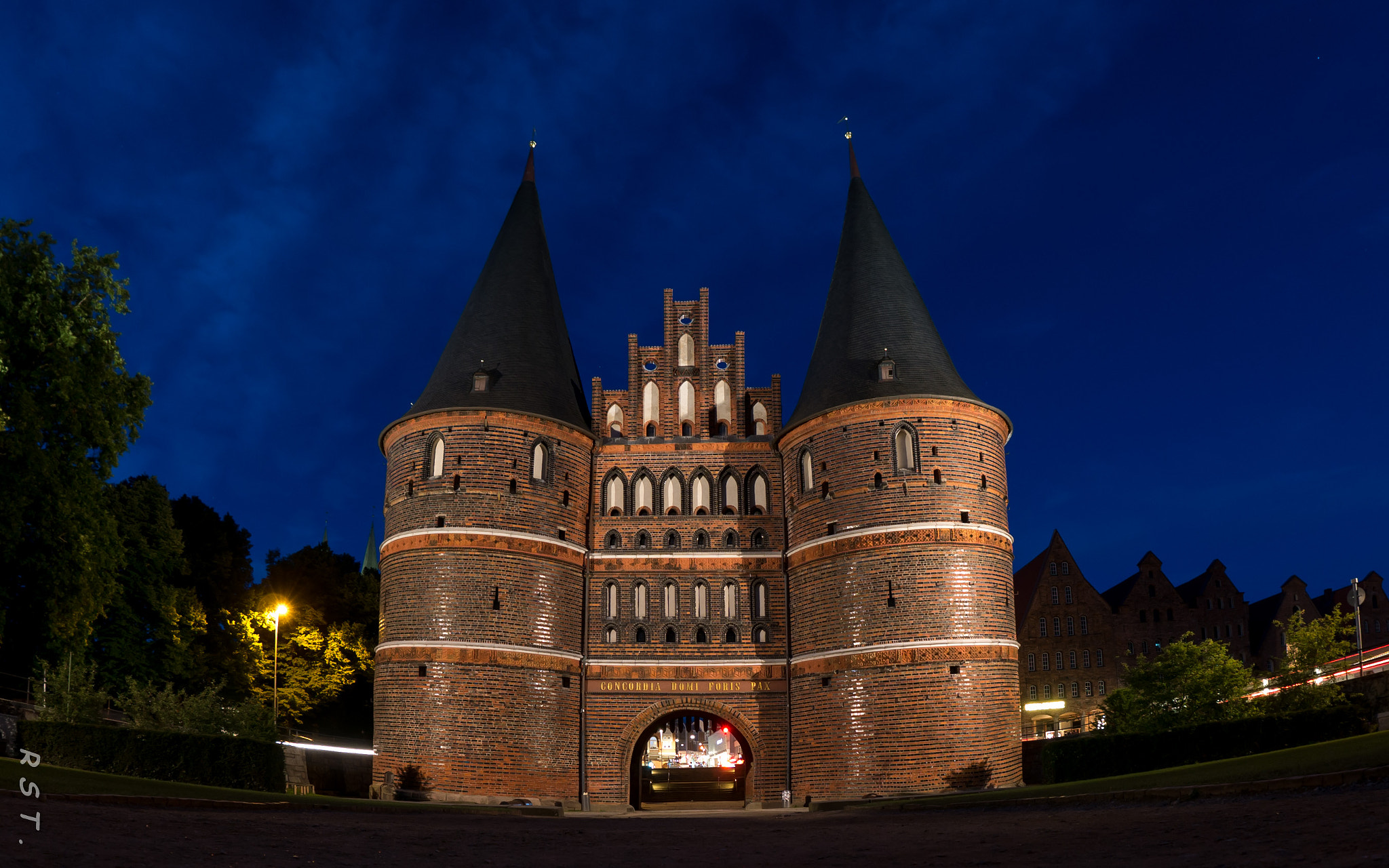Panasonic DMC-G70 + OLYMPUS M.8mm F1.8 sample photo. Blue holstentor in luebeck, germany photography