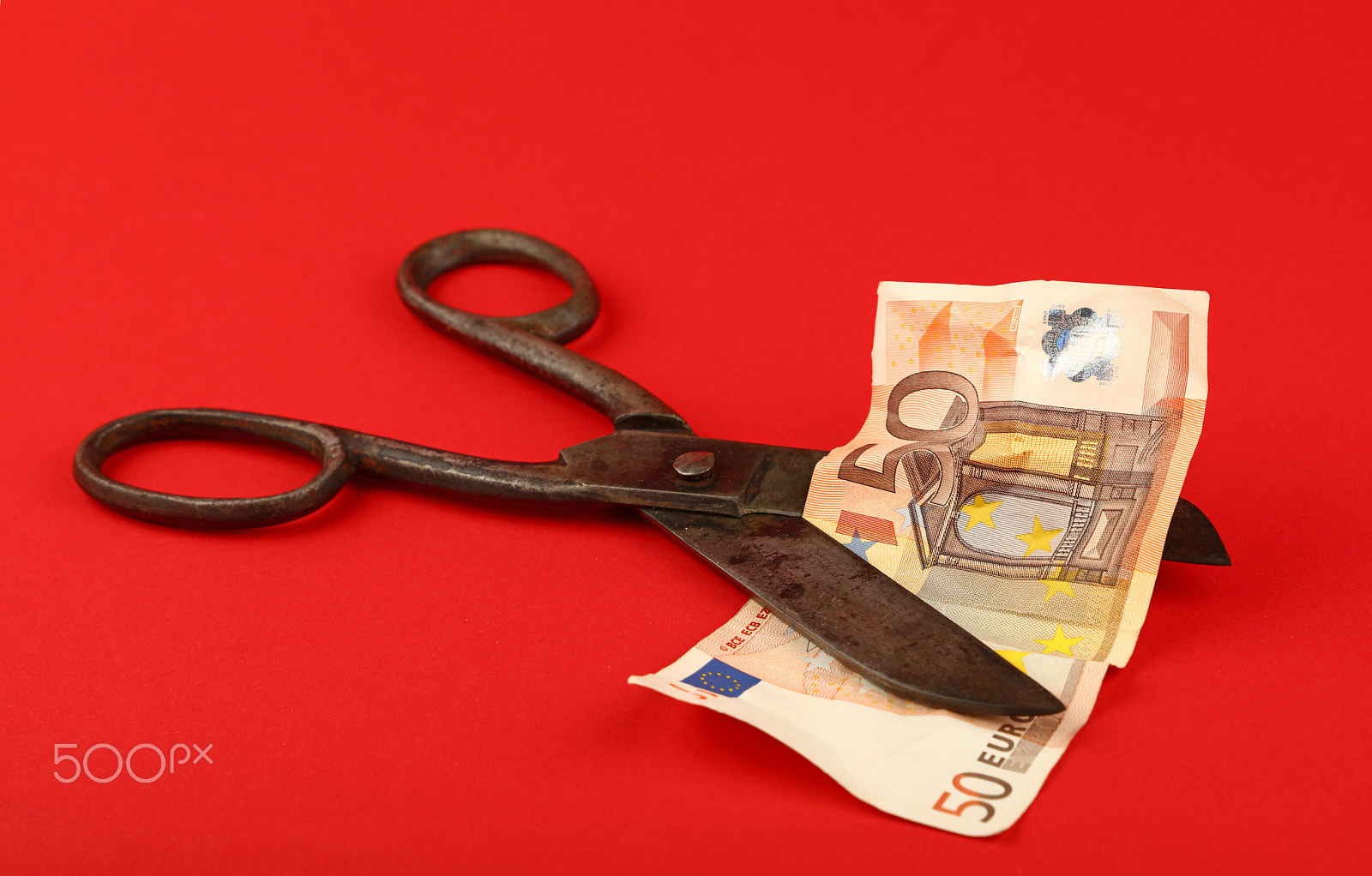 Canon EOS 5DS sample photo. Vintage scissors cut 50 eur banknote on red photography