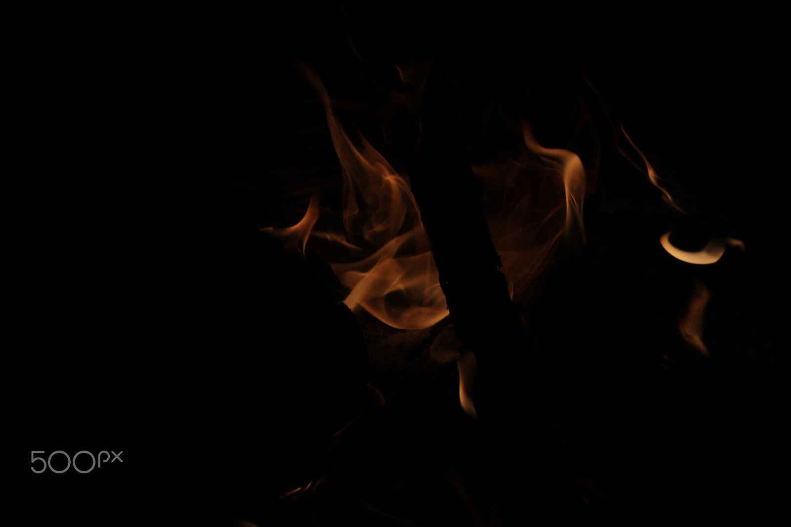 Canon EF-S 18-55mm F3.5-5.6 IS sample photo. Flames with black background photography
