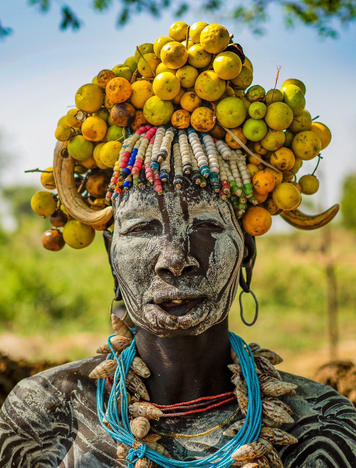 Olympus OM-D E-M1 + Olympus M.Zuiko Digital 25mm F1.8 sample photo. Woman from the mursi tribe photography