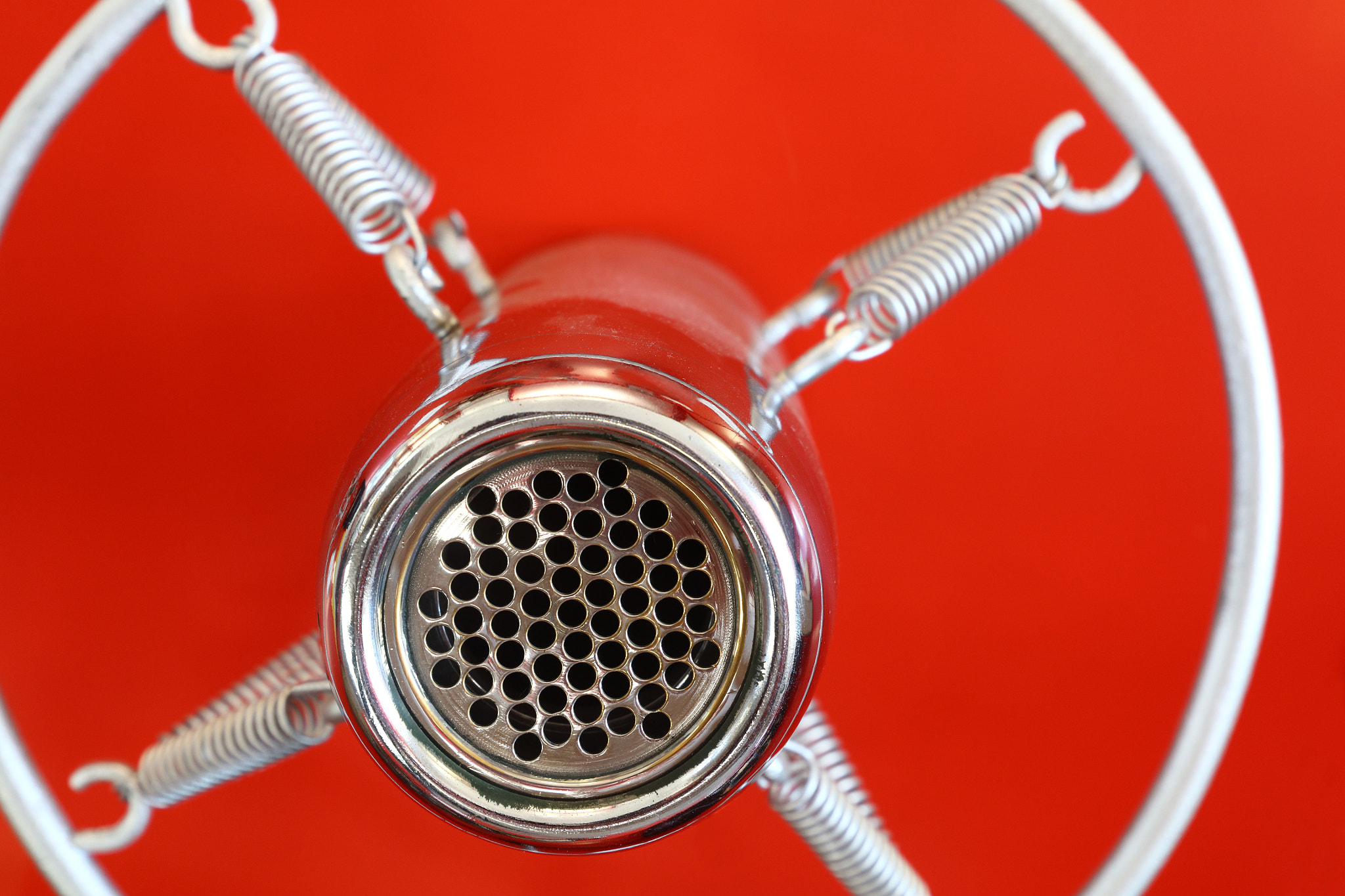Canon EOS 5DS sample photo. Vintage suspended microphone over red photography