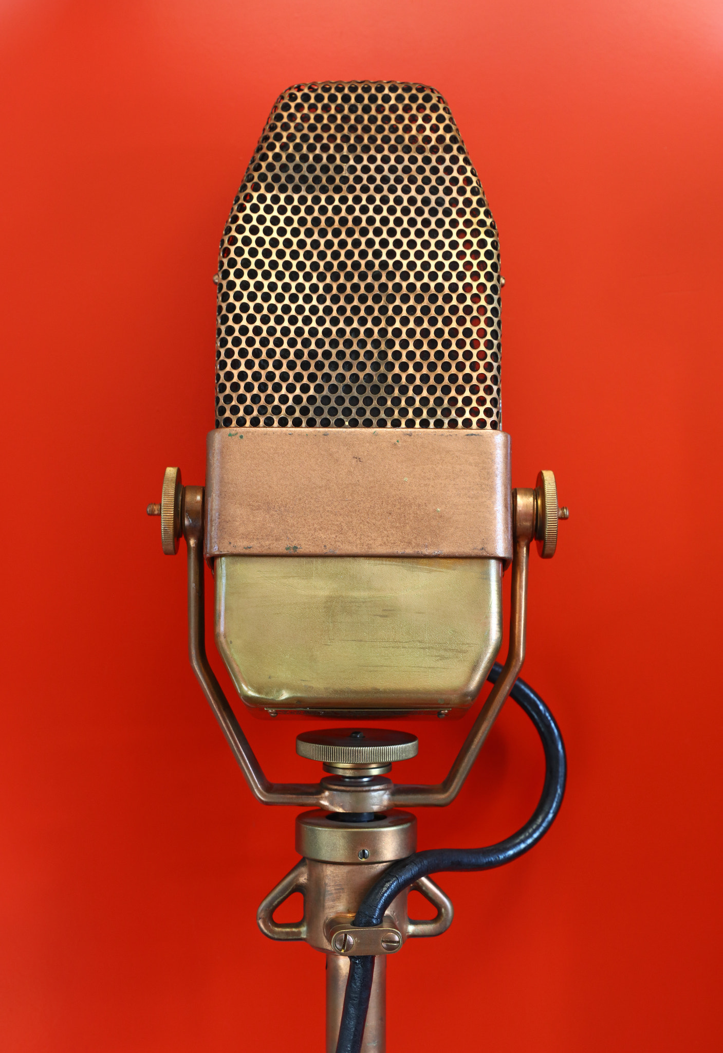 Canon EOS 5DS + Canon EF 24-105mm F3.5-5.6 IS STM sample photo. Vintage metal microphone over red background photography