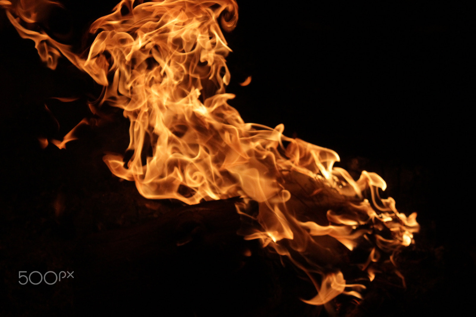 Canon EF-S 18-55mm F3.5-5.6 IS sample photo. Flames with black background photography