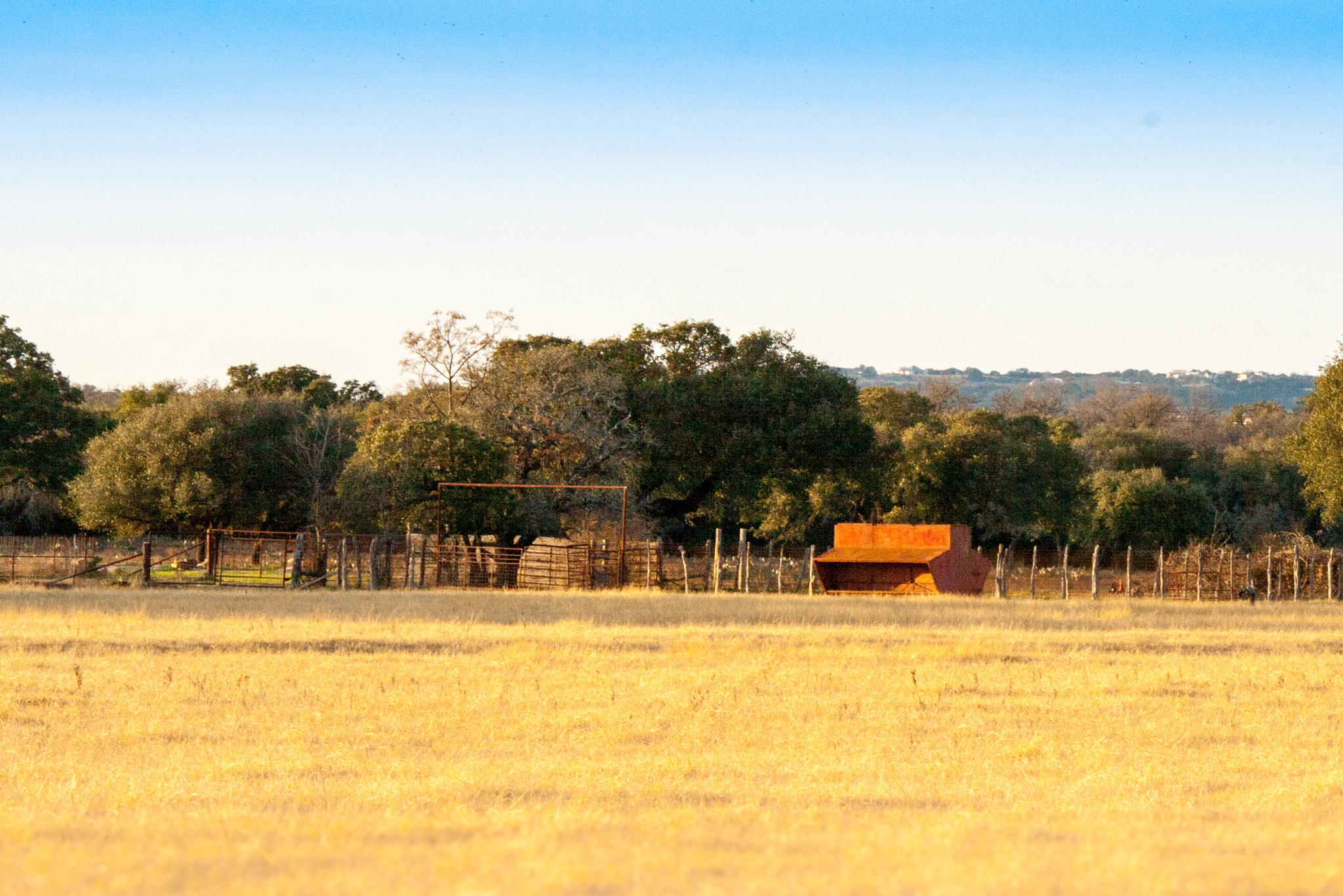 Canon EOS 400D (EOS Digital Rebel XTi / EOS Kiss Digital X) sample photo. Ranch pasture with feeder photography