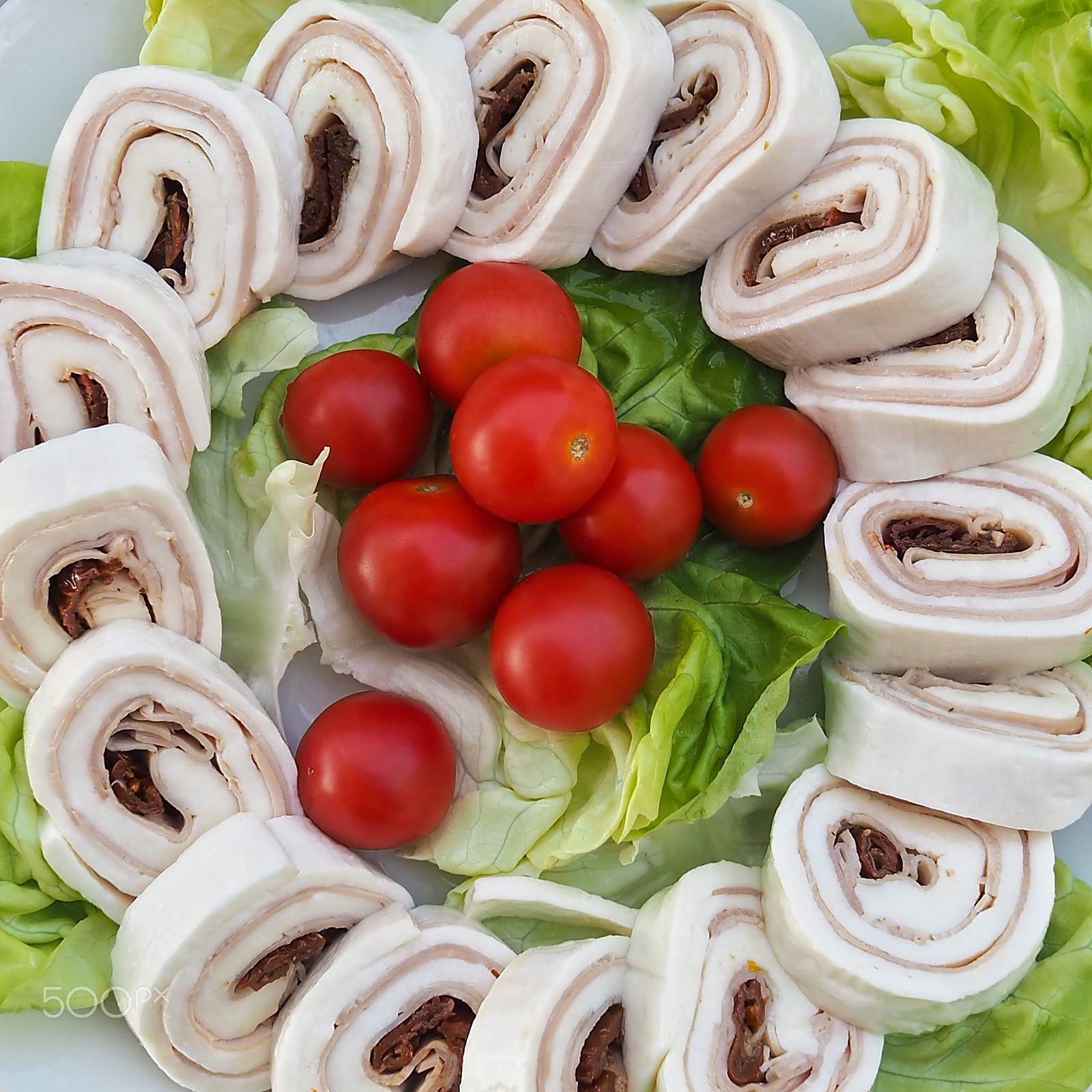 Olympus OM-D E-M10 + Olympus M.Zuiko Digital 17mm F1.8 sample photo. Rolls of mozzarella with olives and ham specialties to taste in naples photography