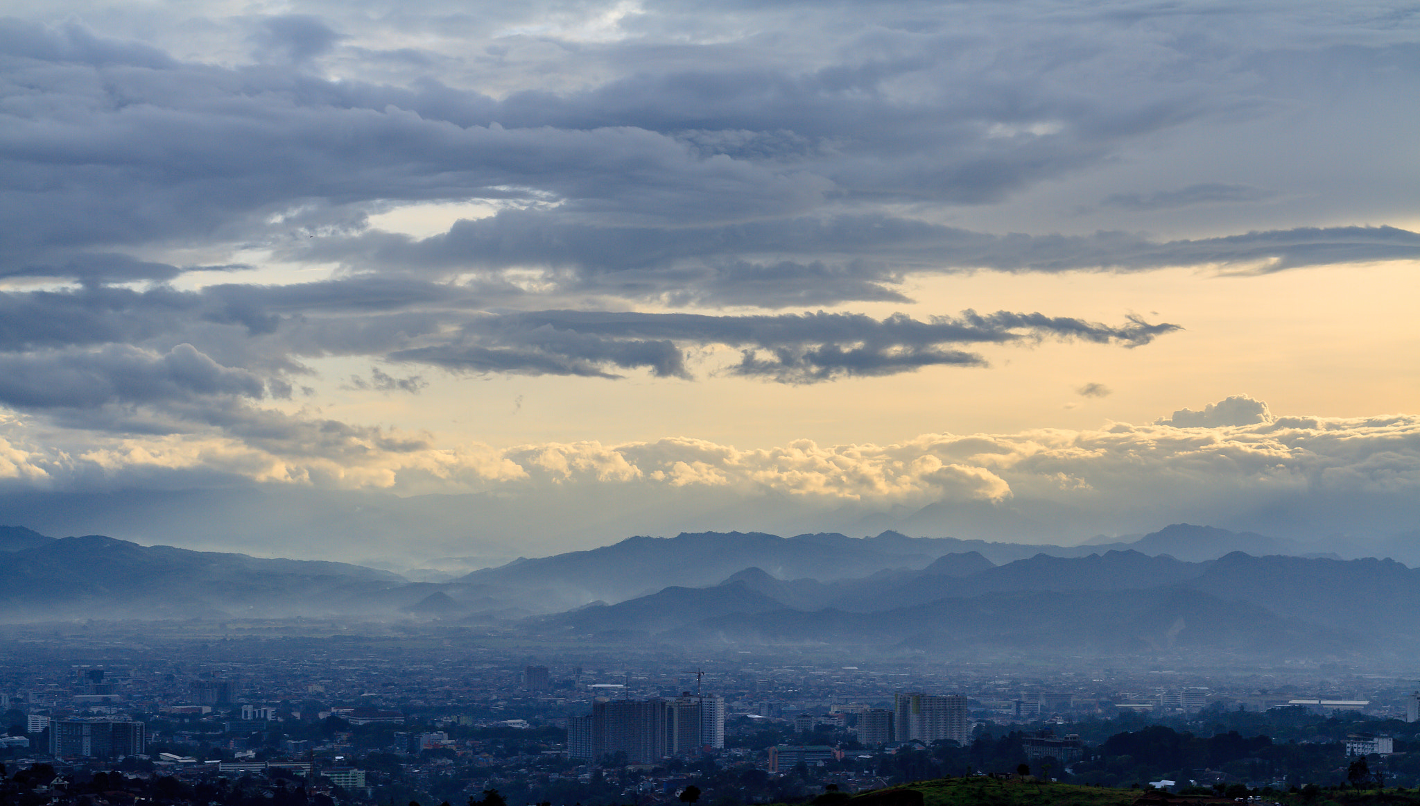Canon EF 35-80mm f/4-5.6 sample photo. City covered with fog photography