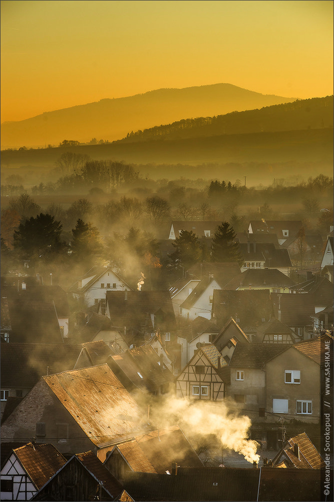 Sony a99 II sample photo. Aerial view to obernai and silhouettes of montains on horizon photography