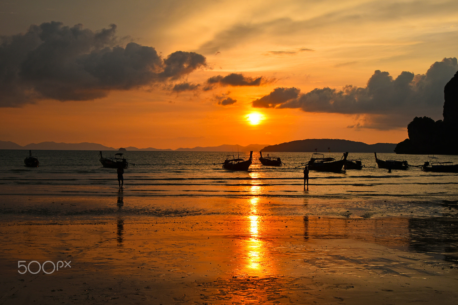Nikon D5500 sample photo. Sunset over sea beach with silhouettes of boats photography