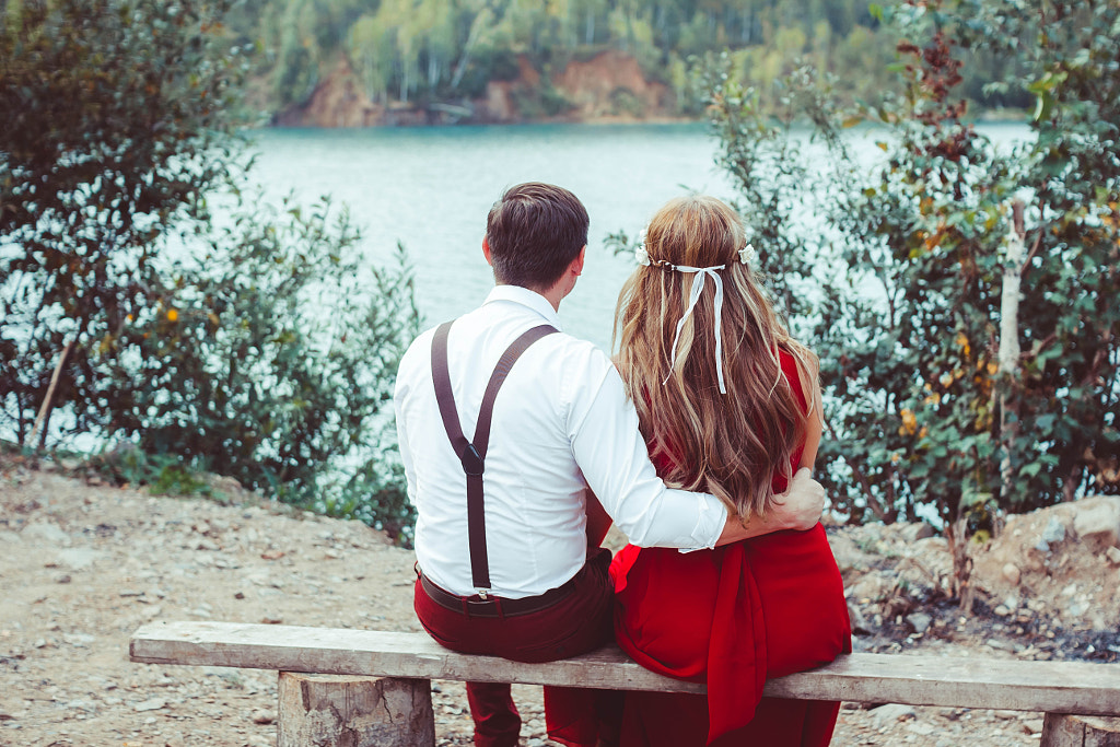 Couple poses - lovers sitting by the water on the bench by ????? ????????? on 500px.com