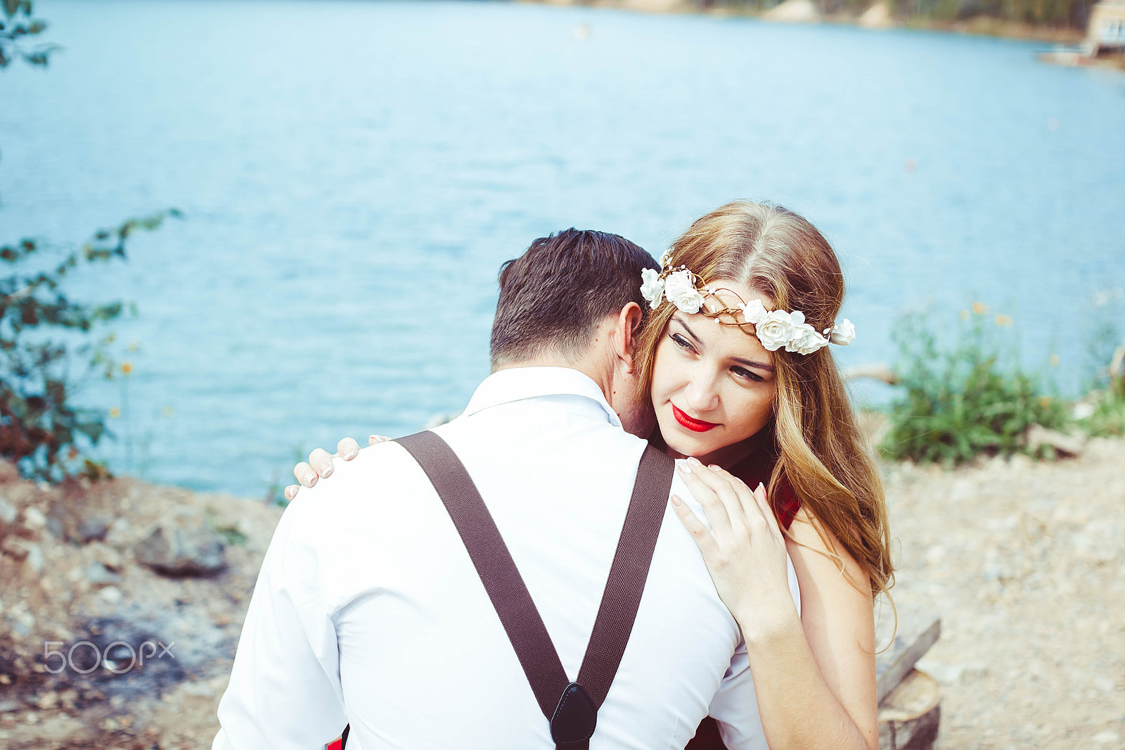Sigma 30mm F1.4 EX DC HSM sample photo. Couple sitting by the lake hugging photography