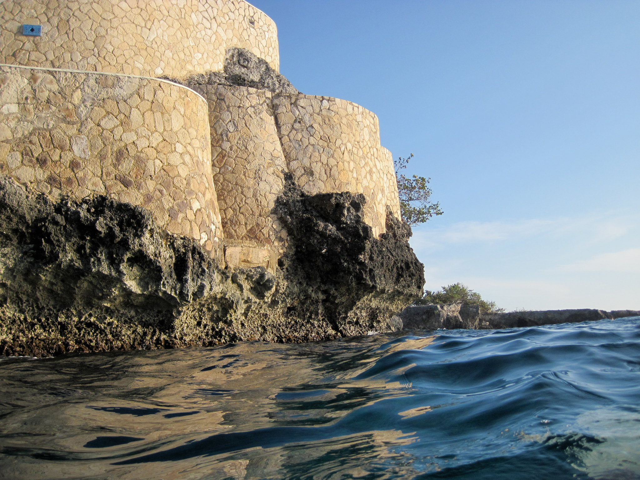 Canon PowerShot D10 sample photo. Cliffs near sundancer from the ocean photography