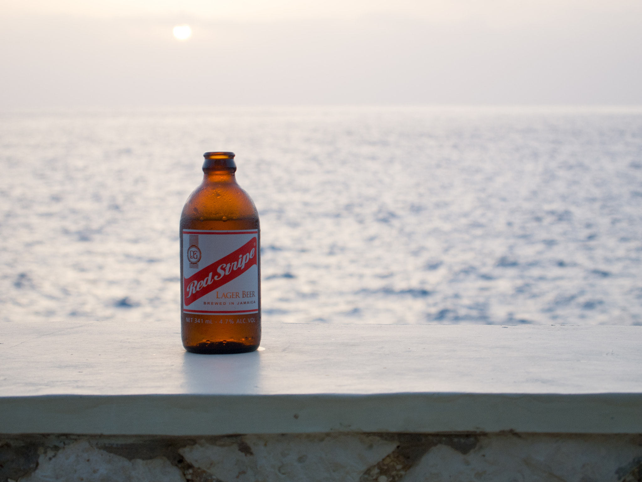 Olympus PEN E-PL1 sample photo. Red stripe cliffside below sundancer photography