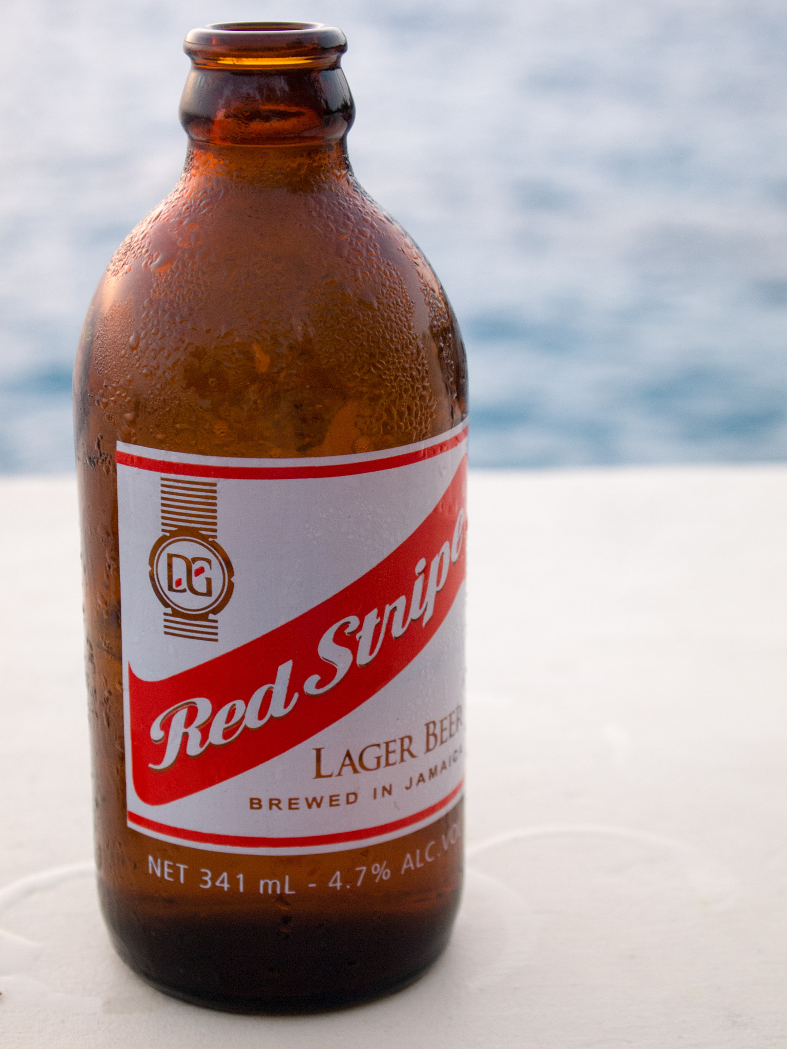 Olympus PEN E-PL1 sample photo. Red stripe cliffside below sundancer photography