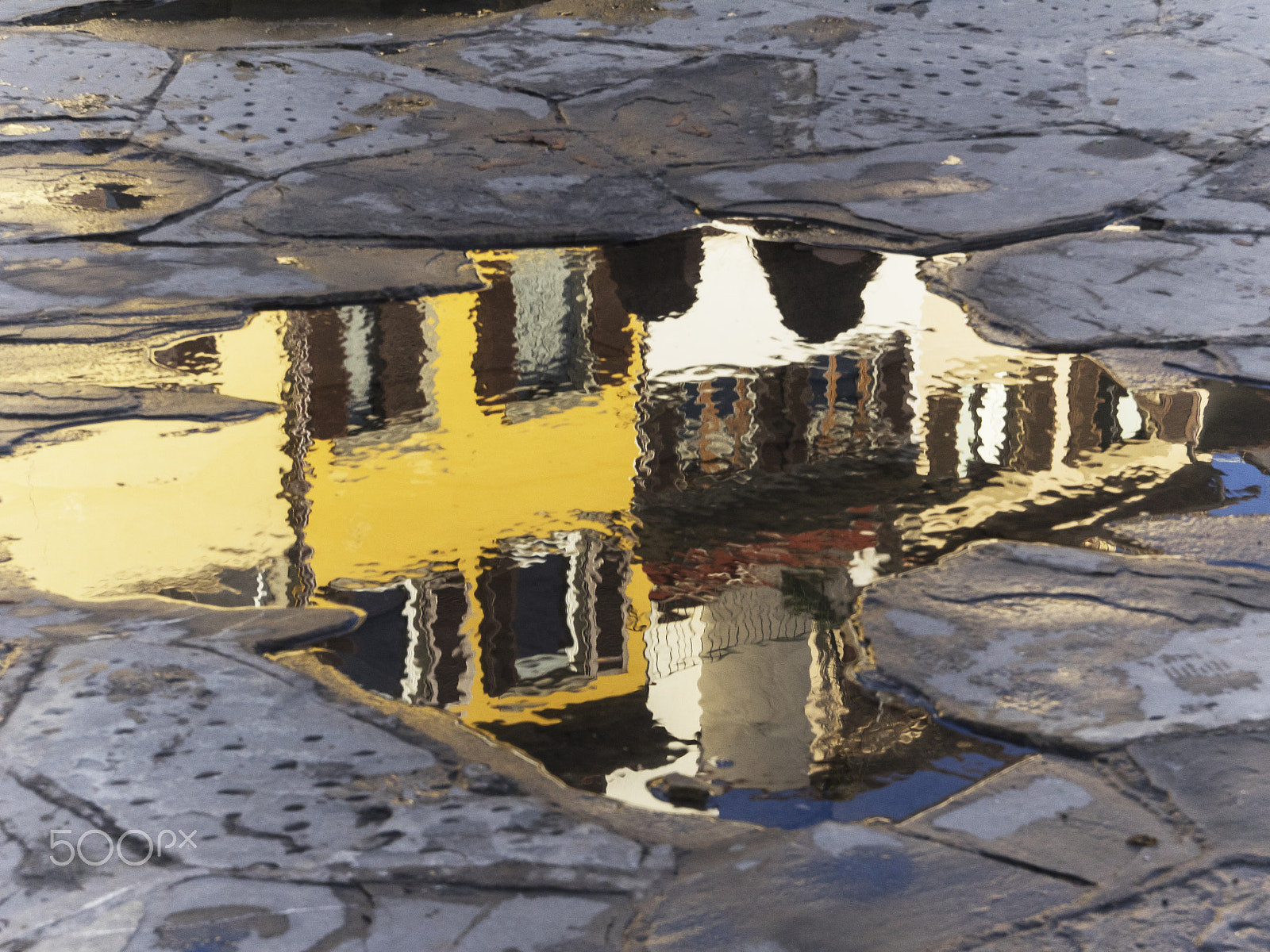 Olympus Zuiko Digital ED 12-60mm F2.8-4.0 SWD sample photo. Puddle on the pavement photography