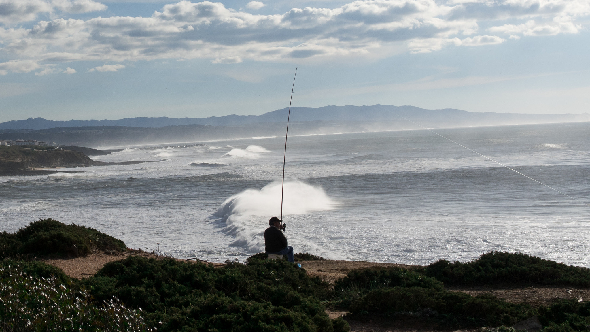 .7x Metabones 18-35/1.8 sample photo. Fisherman on the cliff photography
