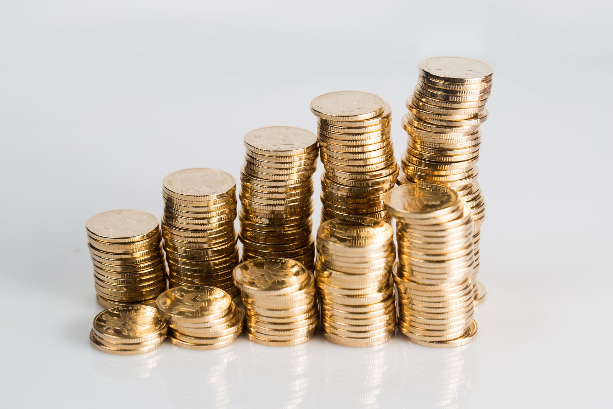 many coins on a white background