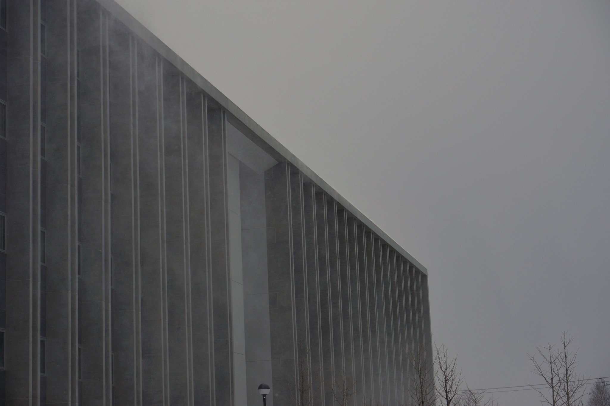 Sony E 50mm F1.8 OSS sample photo. Snow dancing school building photography