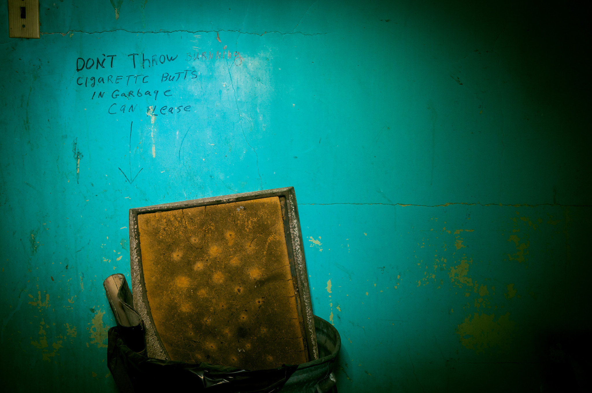 Nikon D300 sample photo. Don't throw burning cigarette butts in garbage photography