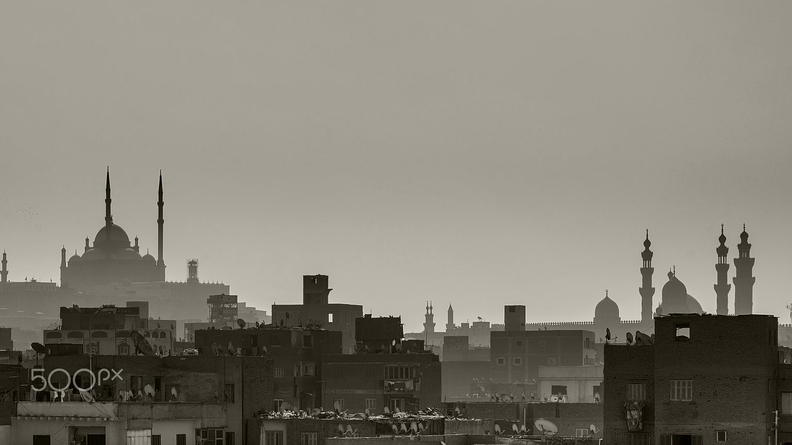 Nikon D5500 + Sigma 18-250mm F3.5-6.3 DC OS HSM sample photo. Minarets between buildings skyline of majestic cairo photography