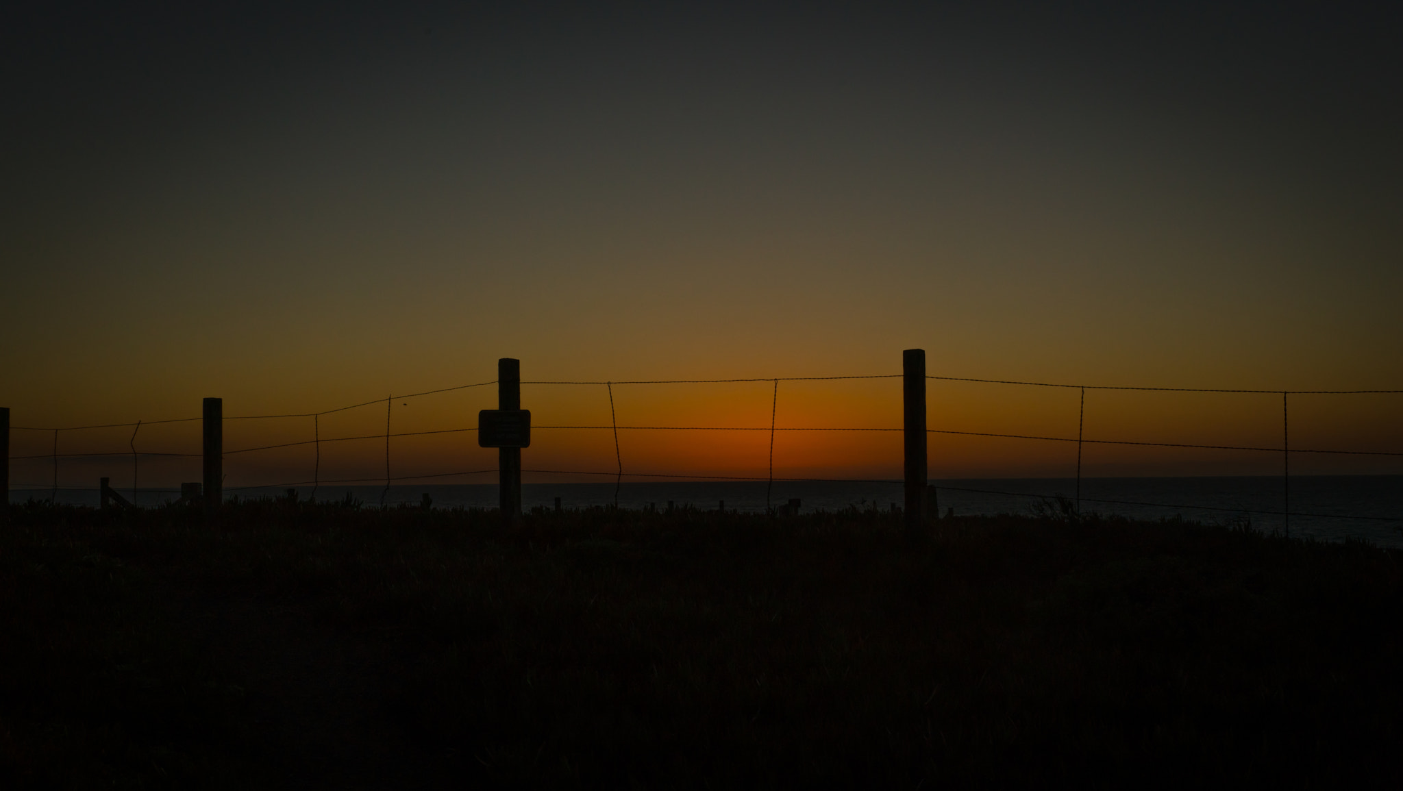 E 35mm F2 sample photo. Fence by the sea photography