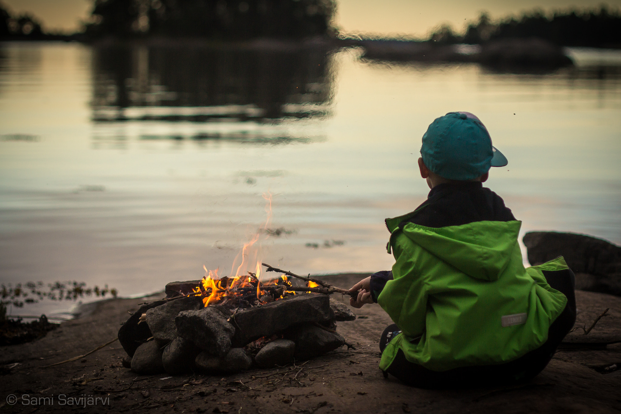 Canon EF 35-80mm f/4-5.6 sample photo. Boy at campfire photography