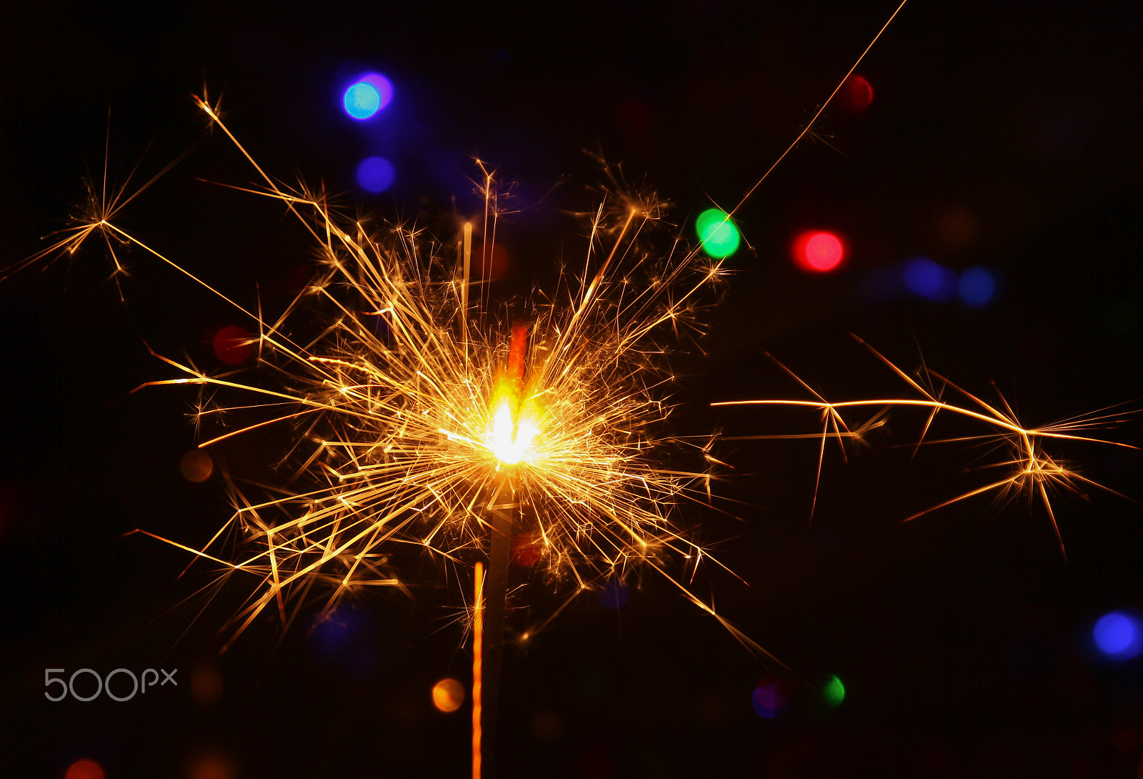 Canon EF 24-70mm F4L IS USM sample photo. Sparks during burning sparklers photography
