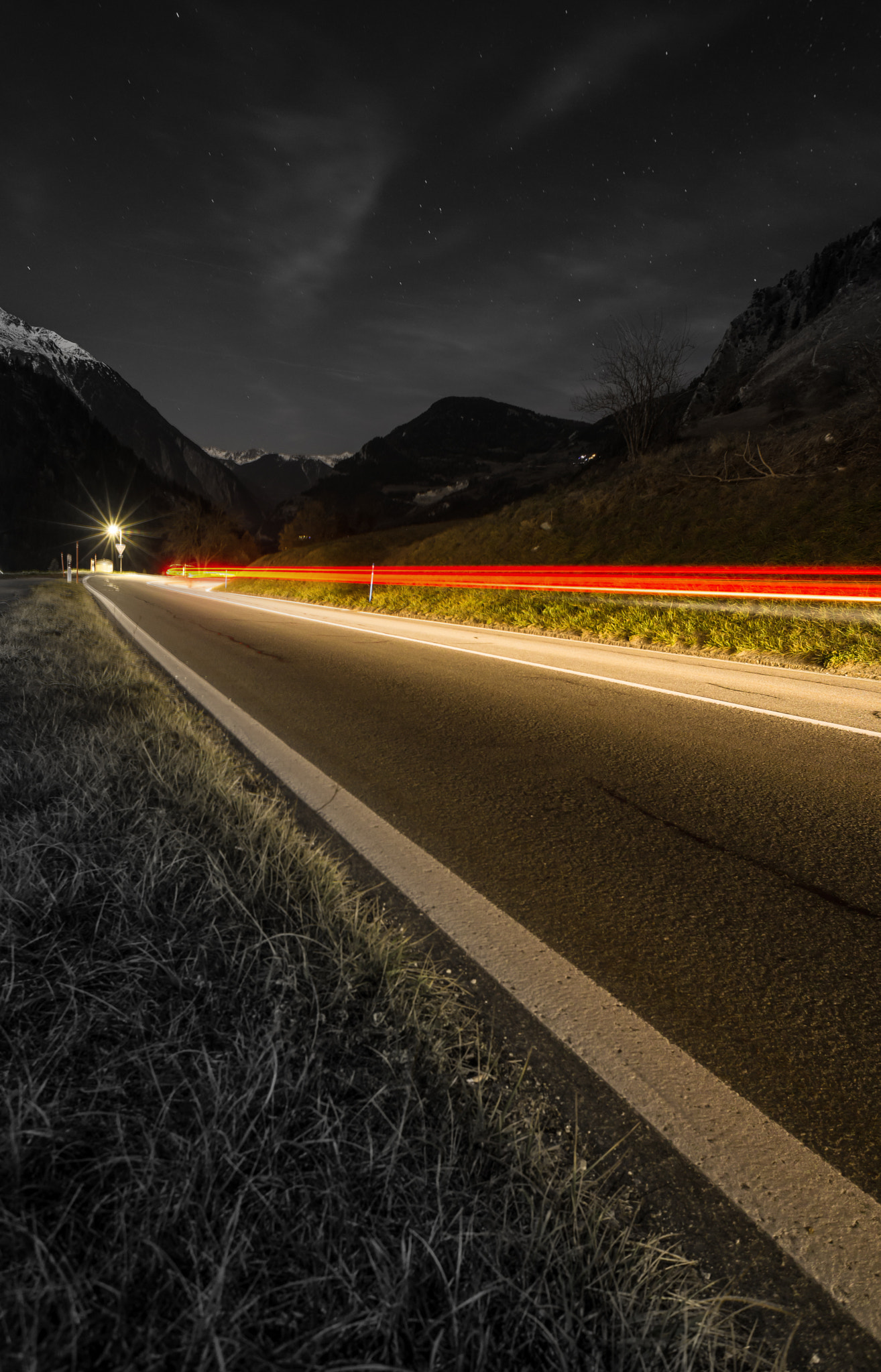 Nikon D610 sample photo. Light trails in the mountains - black and white photography
