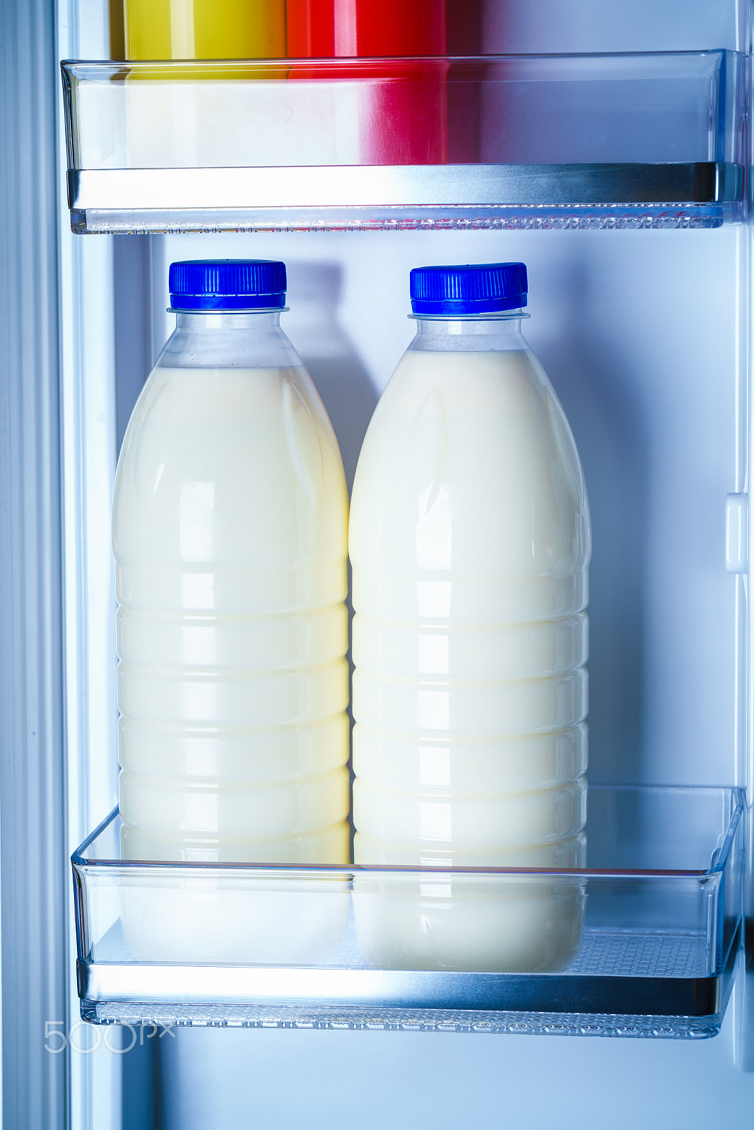 Sony a7R II + Canon EF 100mm F2.8L Macro IS USM sample photo. Bottles of milk in the fridge photography