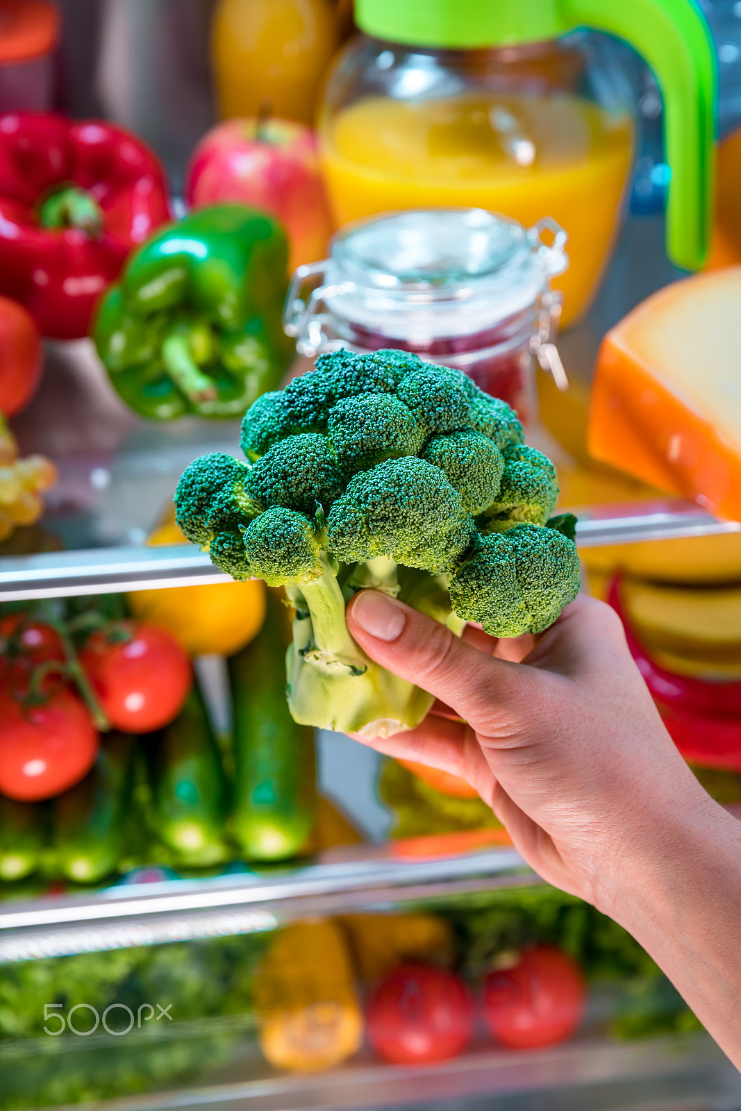 Canon EF 24-70mm F2.8L II USM sample photo. Woman takes the broccoli from the open refrigerator. photography